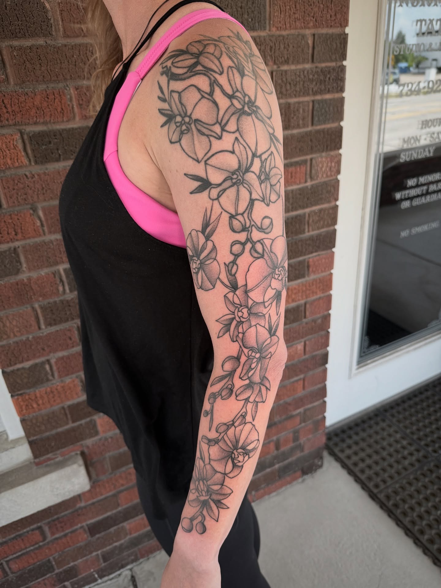 Floral bouquet black and grey tattoo on the forearm by Jeremy Utley
