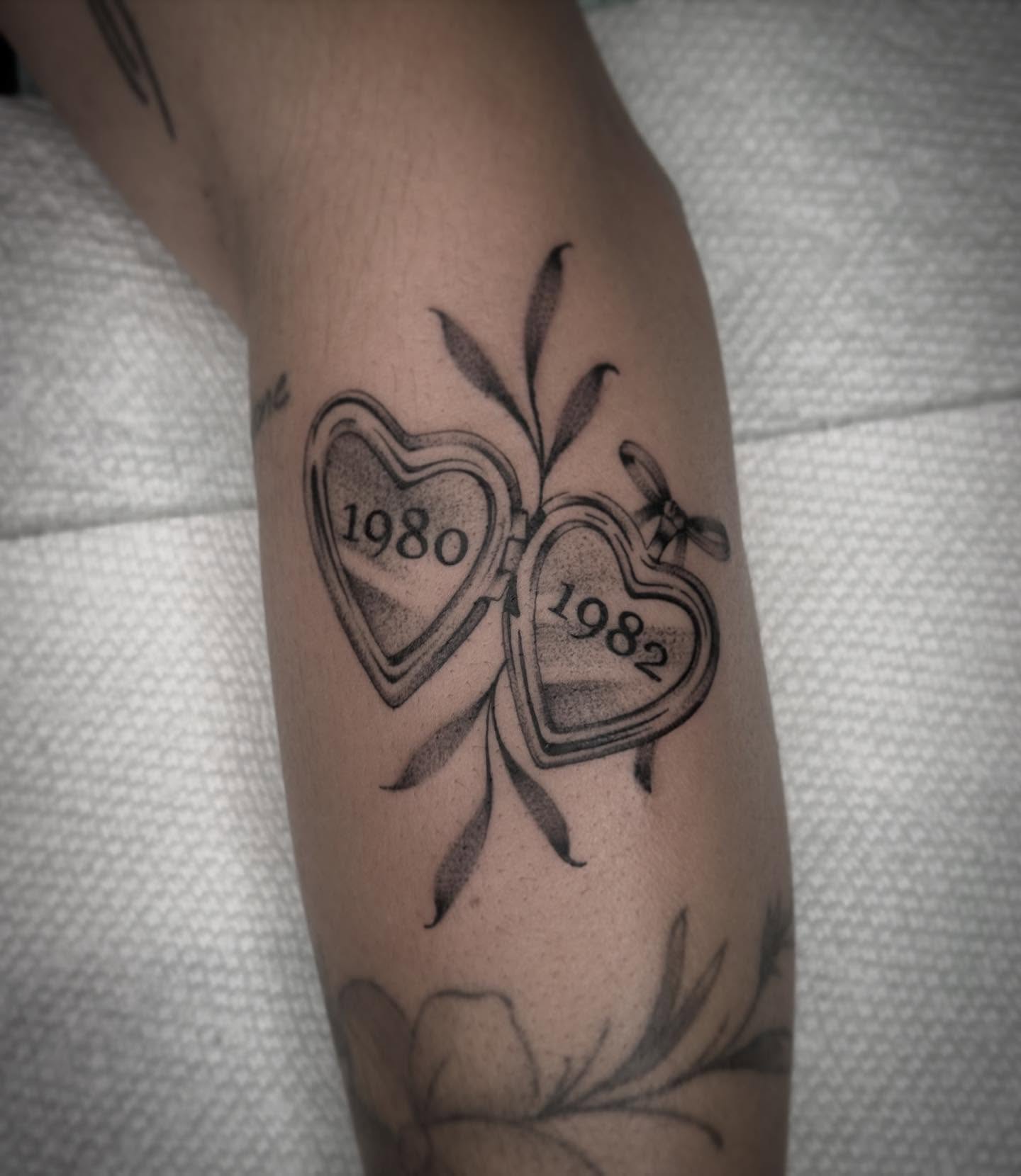 Split hearts dotwork tattoo on the forearm by Kayla Shoffner