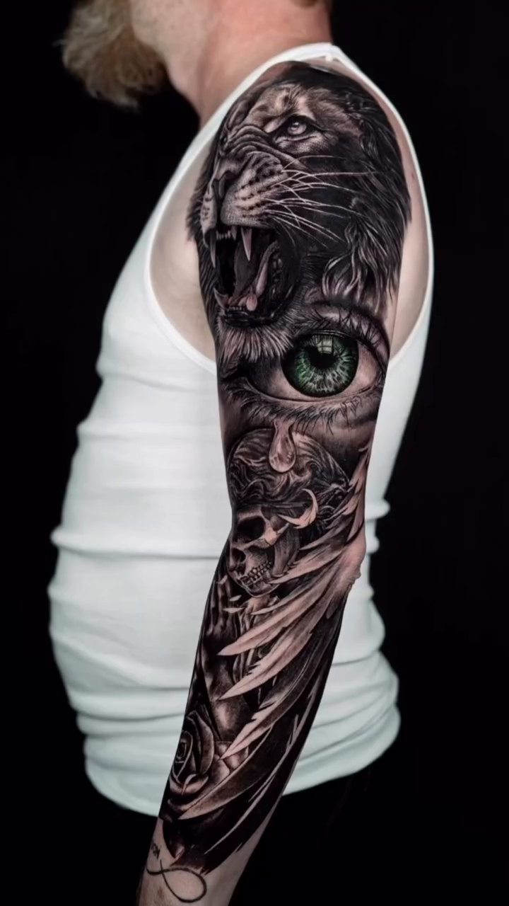 Lion and eye realism tattoo by Keebs