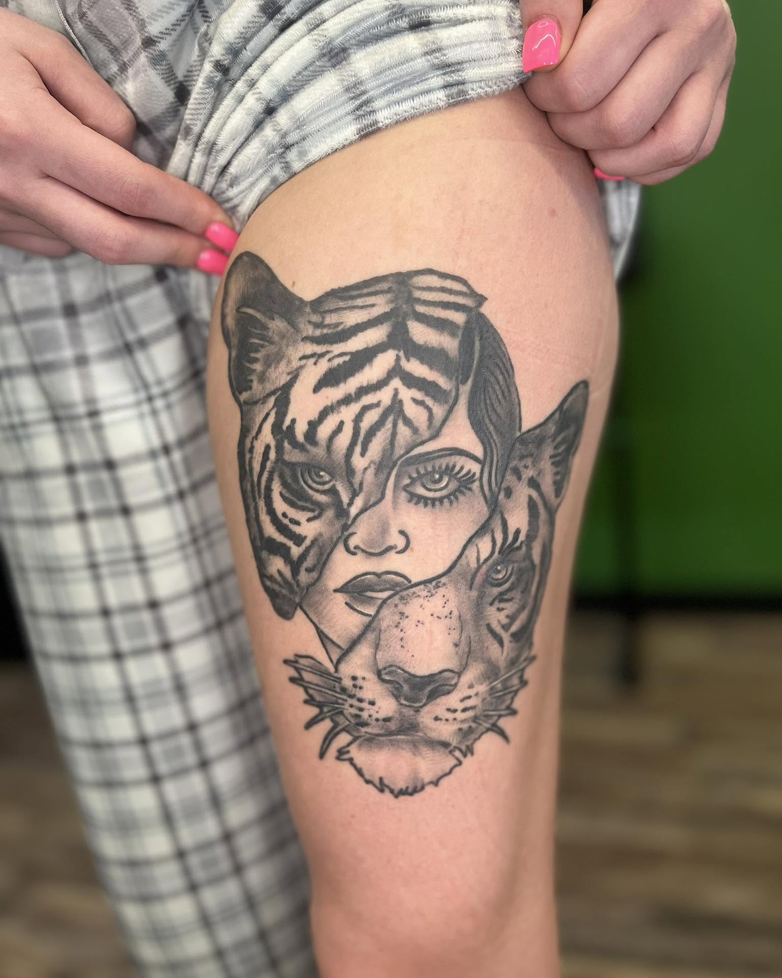 Woman with tiger realism tattoo on the thigh by Josh Roberts, Franklin, Ohio