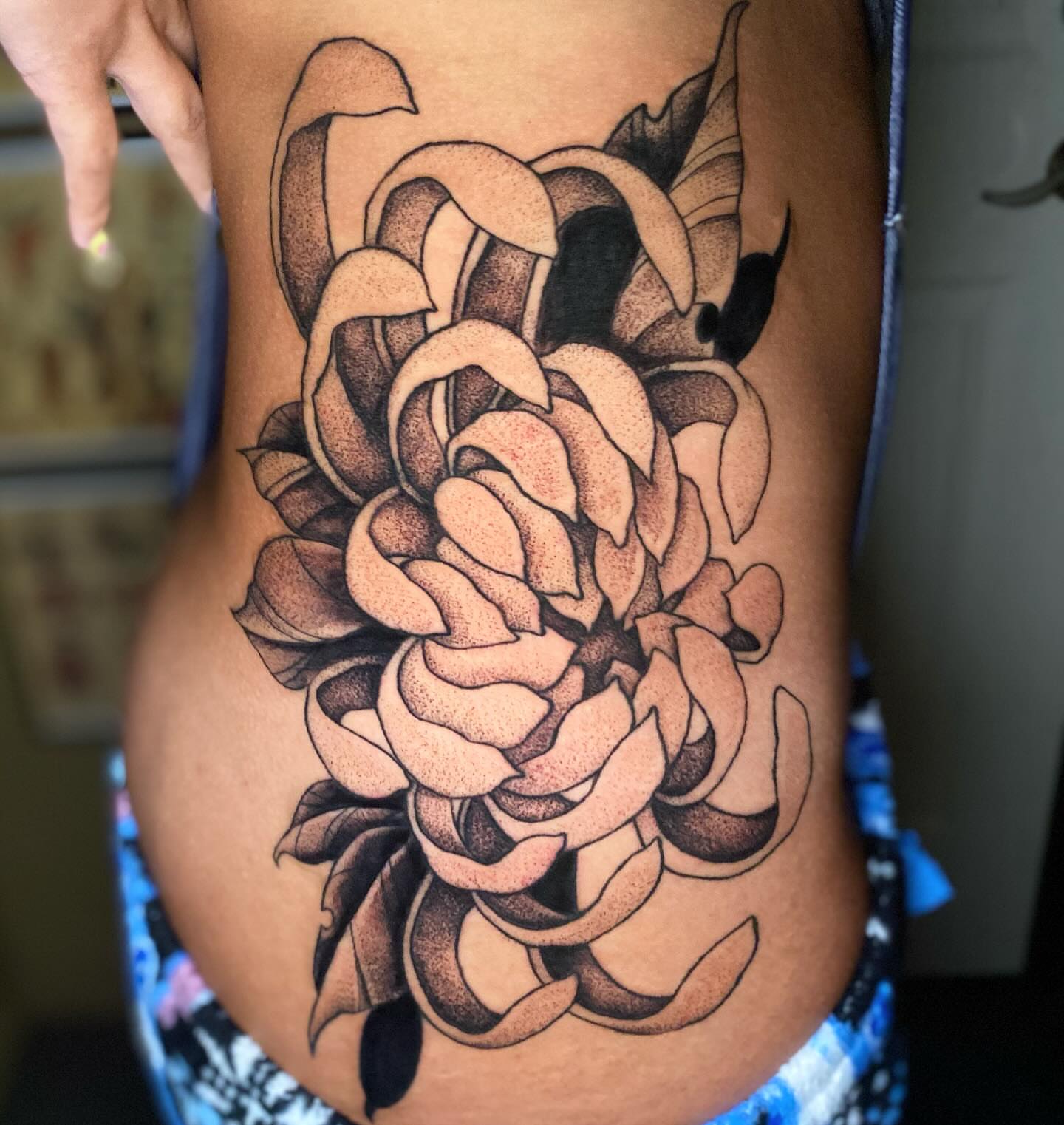 Peony dotwork tattoo on the thigh by Casey Dohner