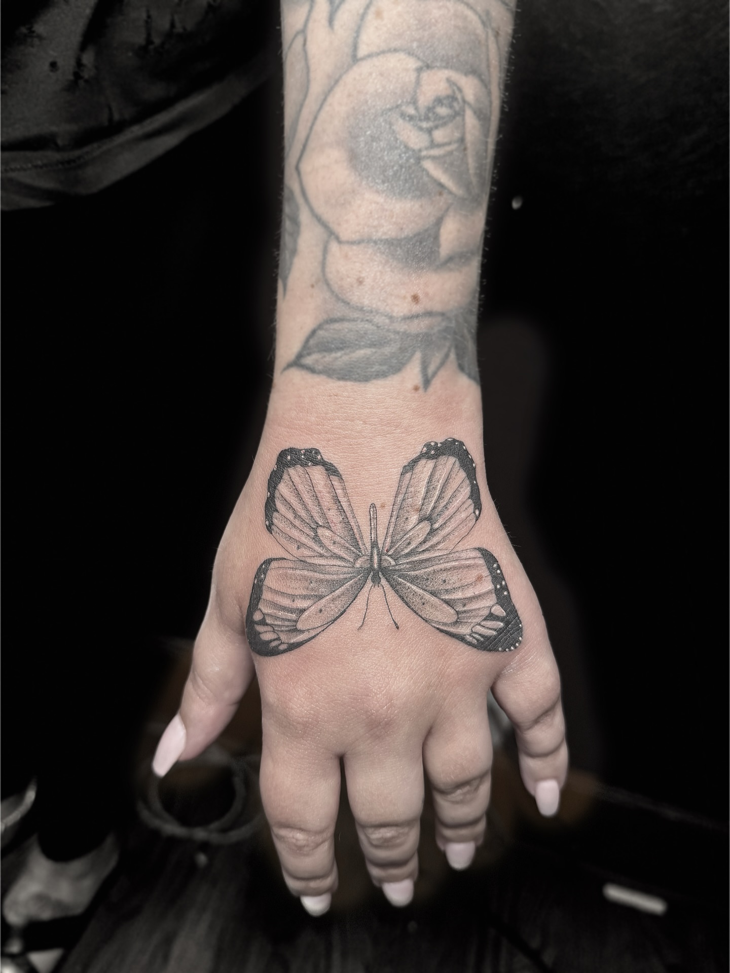 Butterfly black and grey tattoo on the hand by Rafael Alfredo Armas Hoyos, Salt Lake City, Utah