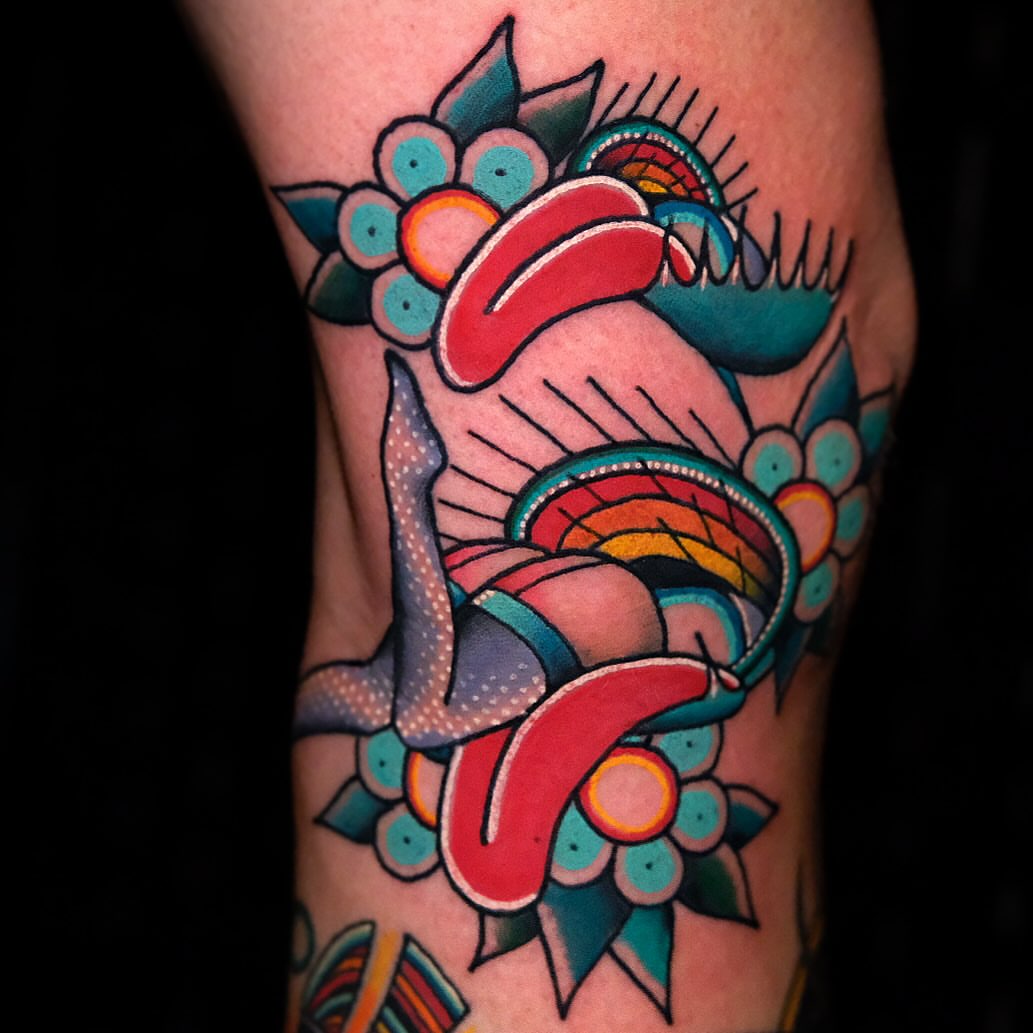 Fish and floral American traditional tattoo on the forearm by Don Boos Tattoos