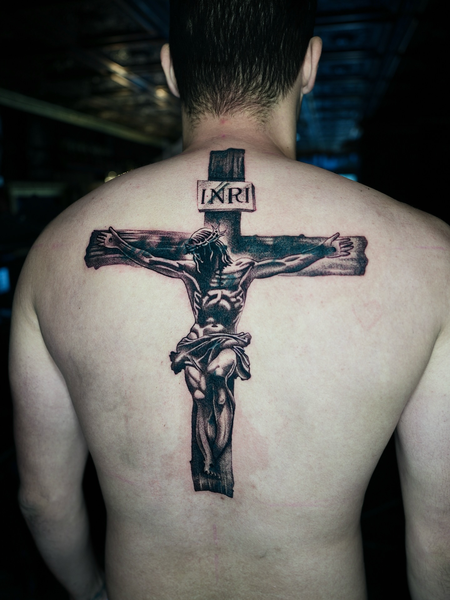 Crucifixion scene realism tattoo on the back by Juan Carlos