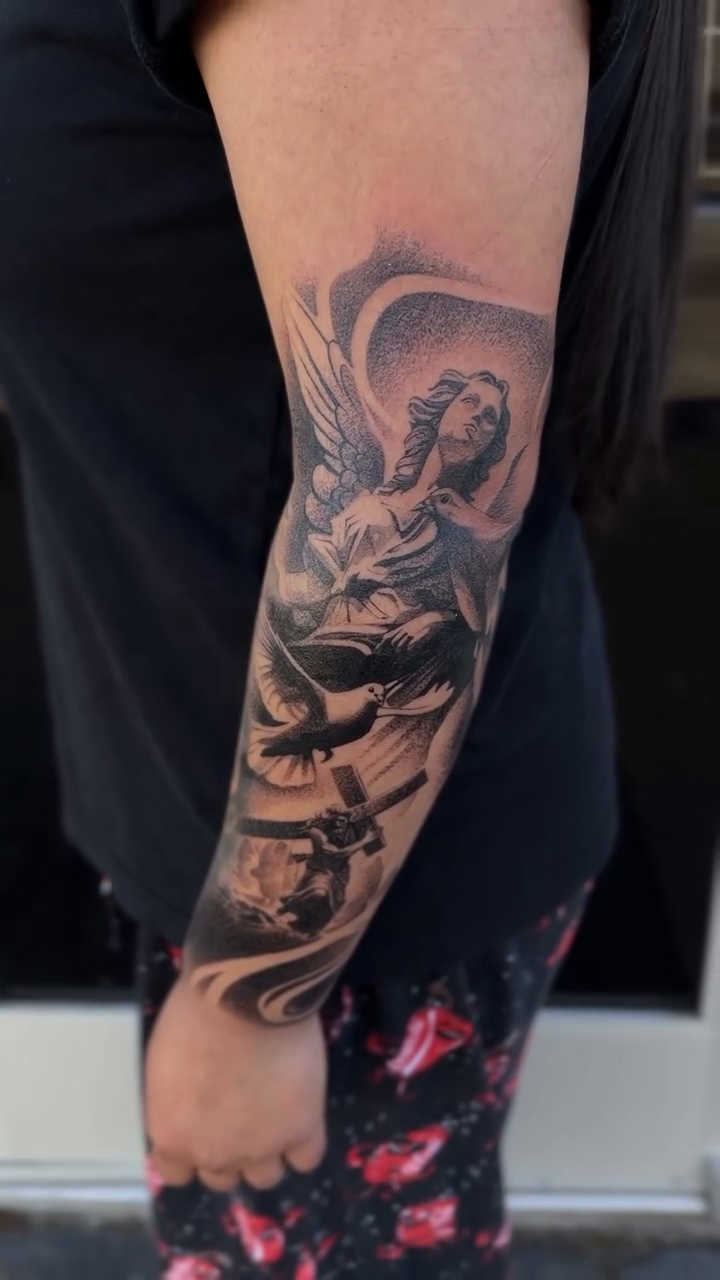Angel with cherubs and architectural elements realism tattoo by sacramento tattoo CA