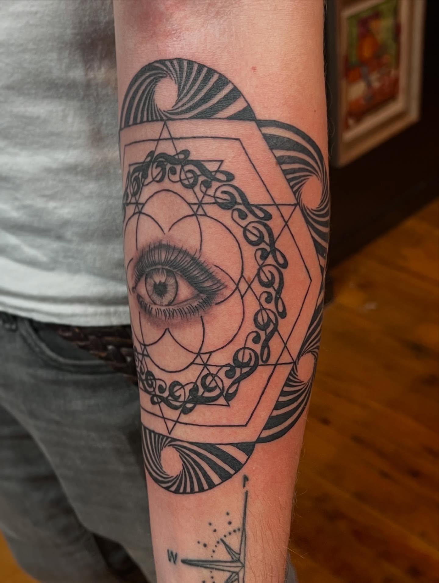 Eye and geometric patterns geometric tattoo on the forearm by Brooke, Kansas City, Missouri