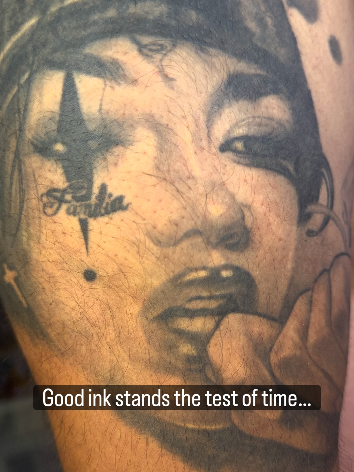 Portrait realism tattoo on the shoulder by Ray Wiggins