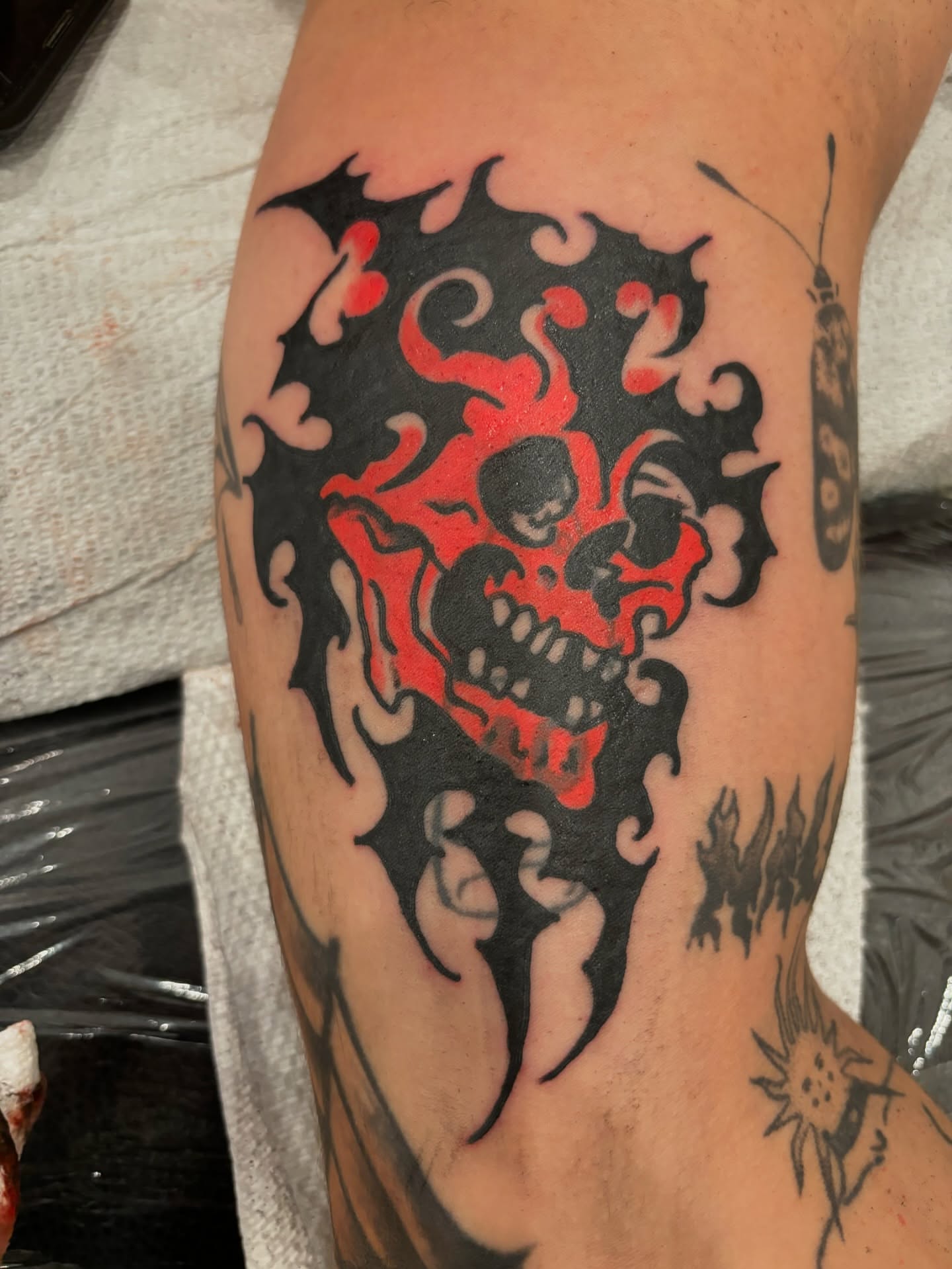 Flaming skull neo-traditional tattoo on the forearm by Francis Cassidy