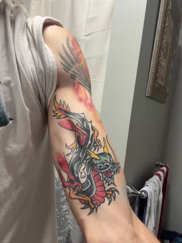 Dragon American traditional tattoo on the forearm by Francis Cassidy