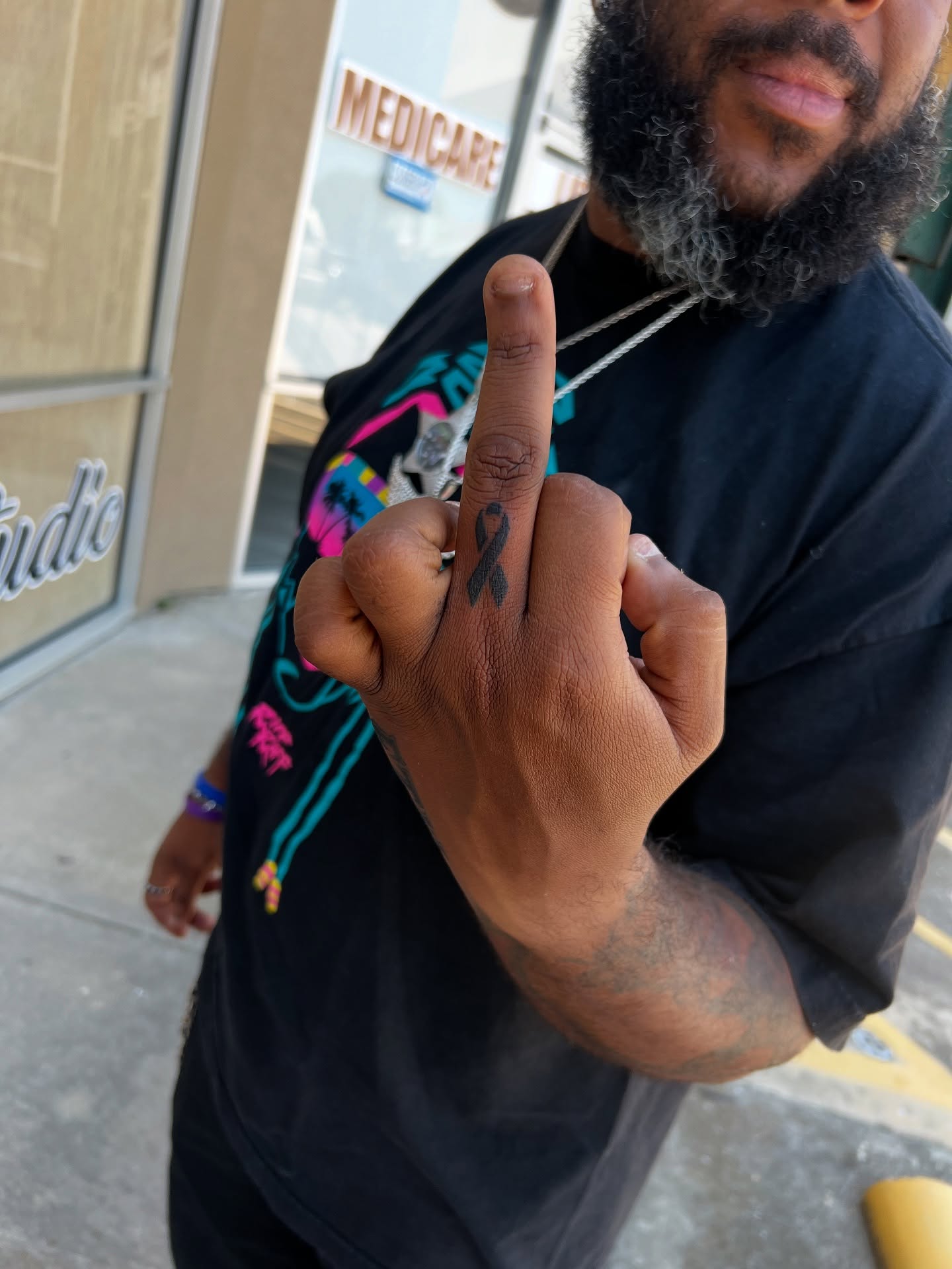 Ribbon black and grey tattoo on the hand by tatman cris 🥀 dfw tattoo artist