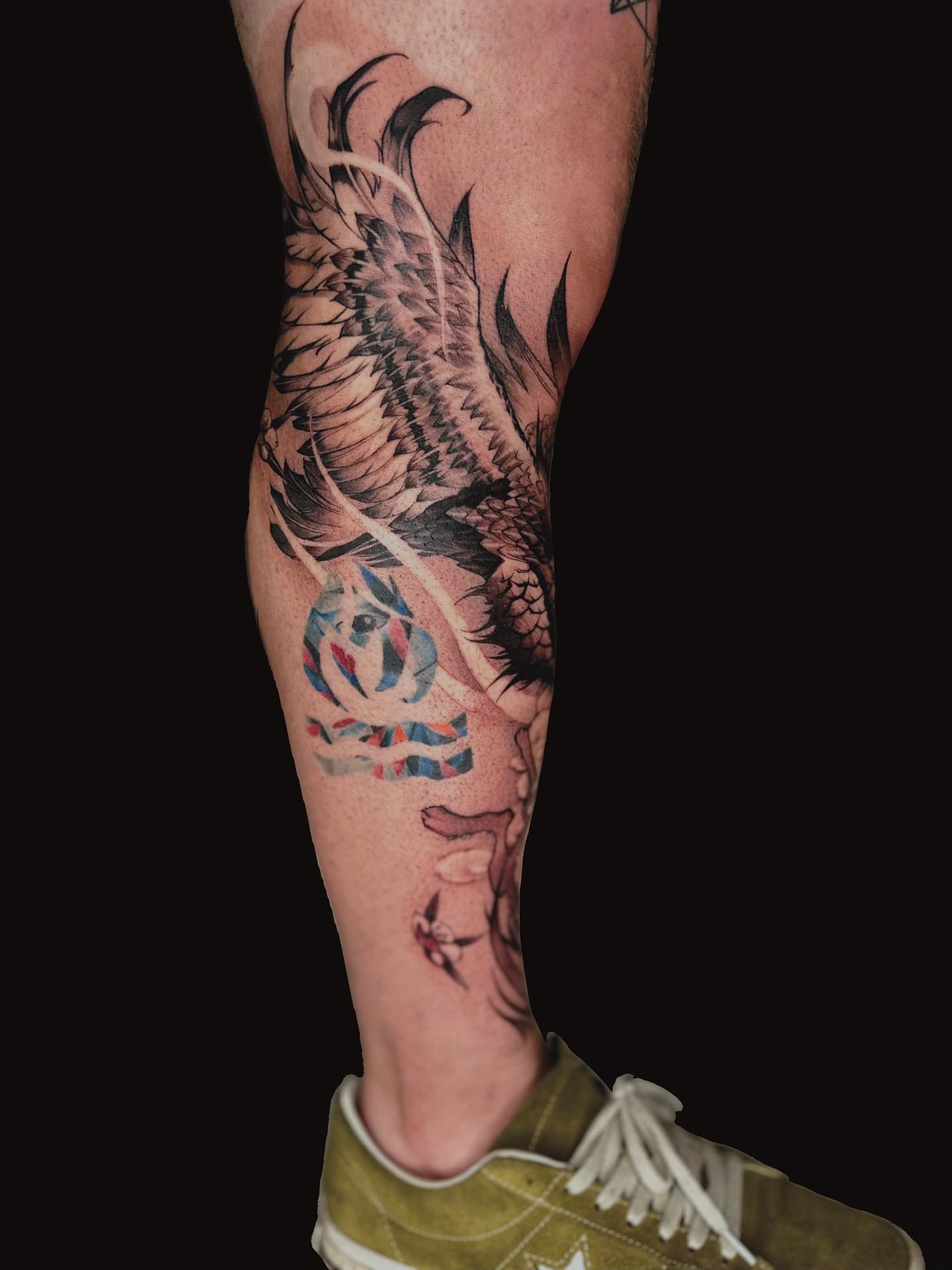 Bird and flower realism tattoo on the calf by Shihao zhao