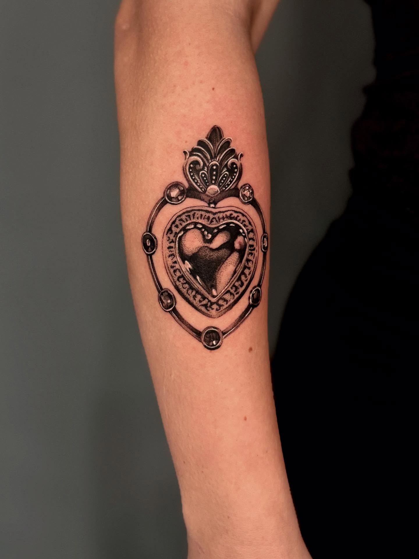 Heart with crown black and grey tattoo on the forearm by Amber Starr, Midvale, Utah
