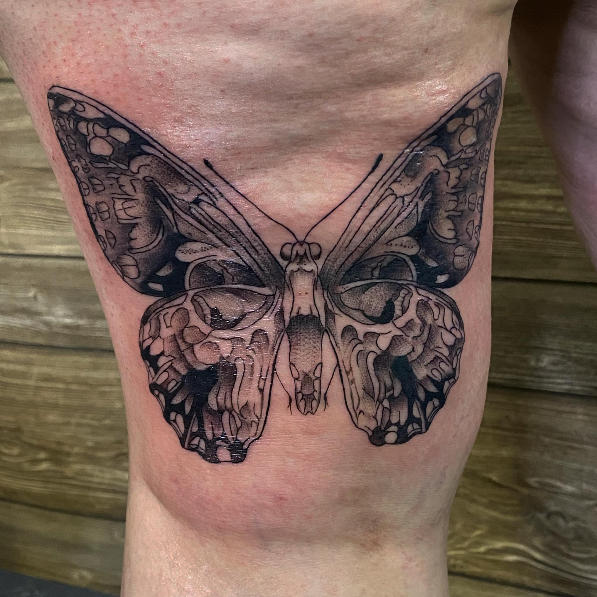 Butterfly realism tattoo on the thigh by Spencer Jones Tattoos