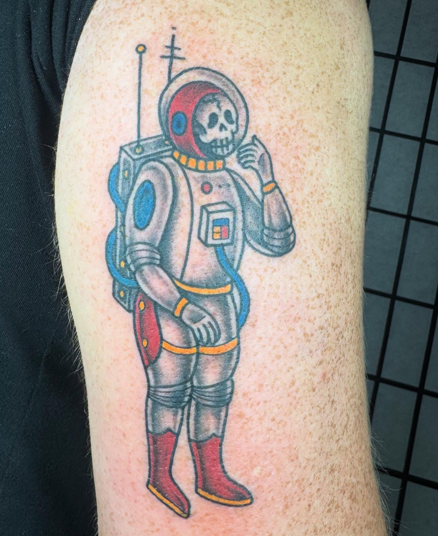 Astronaut skeleton American traditional tattoo on the forearm by Justina🪐