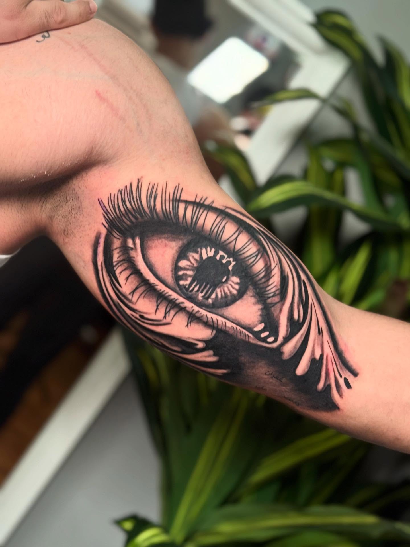 Eye realism tattoo on the forearm by caleb coley