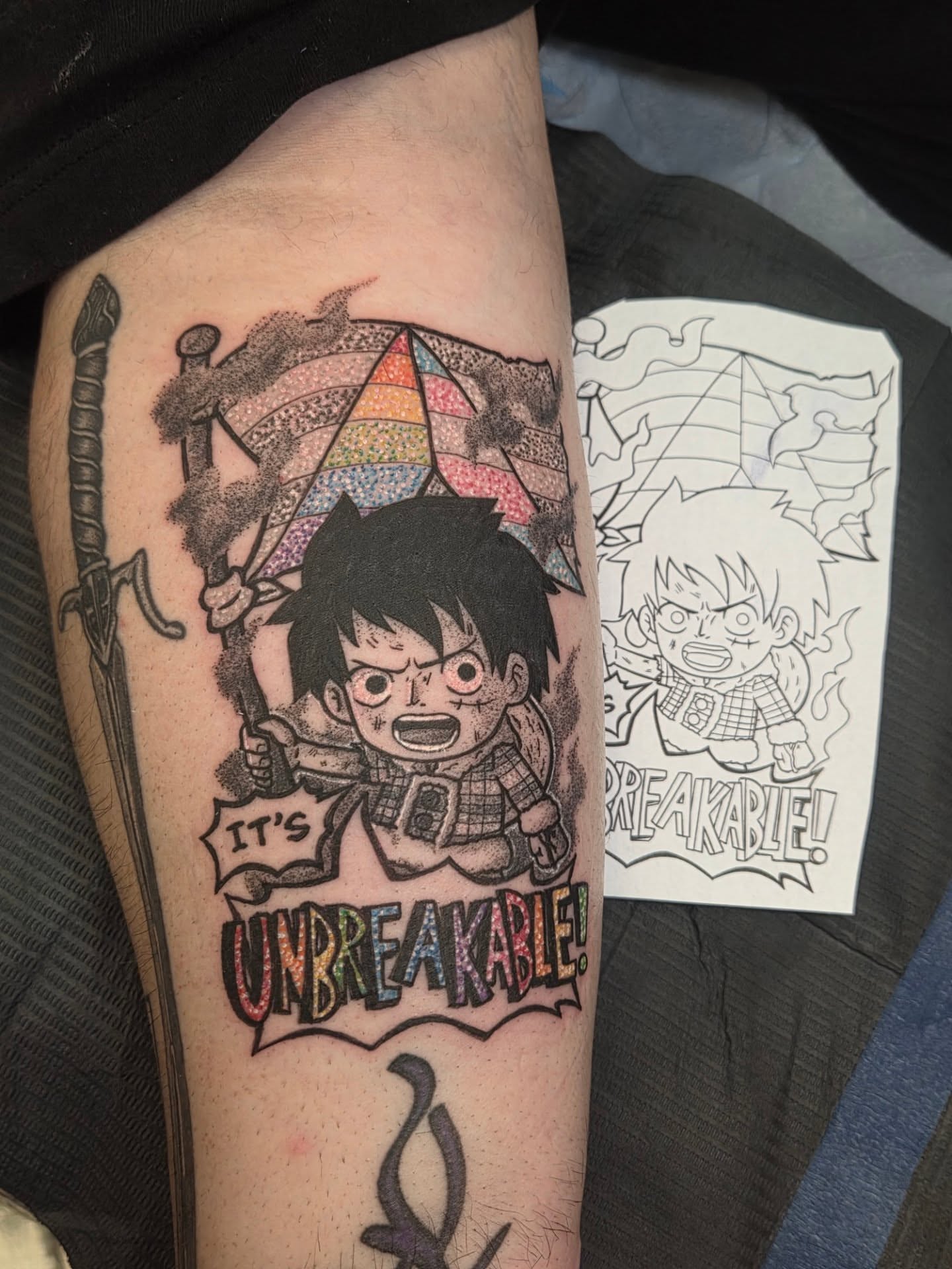 Unbreakable anime tattoo on the forearm by Chaz Escobar