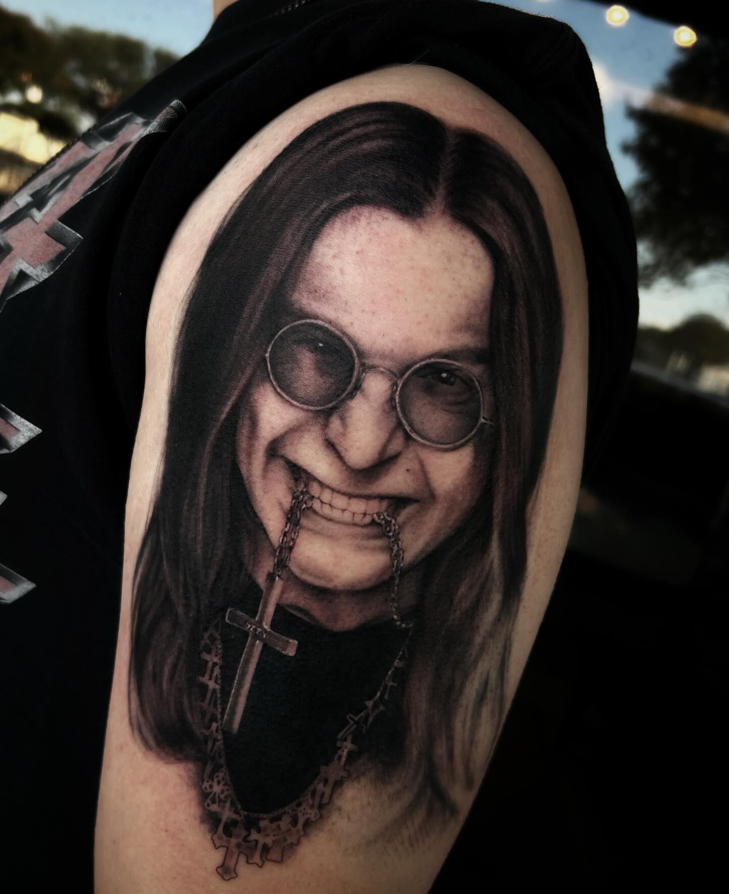 Portrait realism tattoo on the upper arm by 𝖎 𝖆𝖒 𝖗𝖔𝖙𝖙𝖎𝖓𝖌 𝖜𝖎𝖙𝖍 𝖞𝖔𝖚