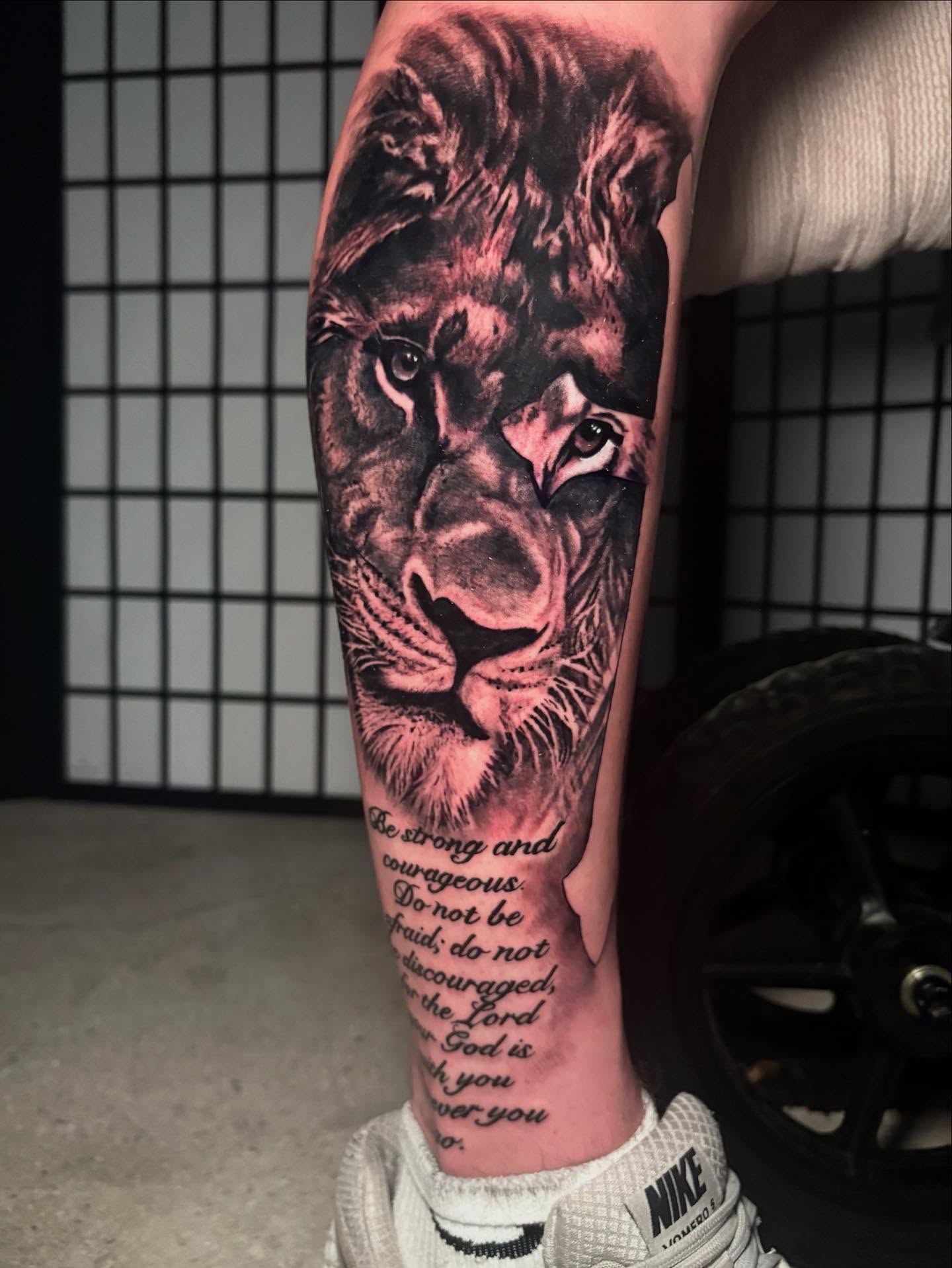 Lion realism tattoo on the forearm by Trusty Dizon Tattoo Artist