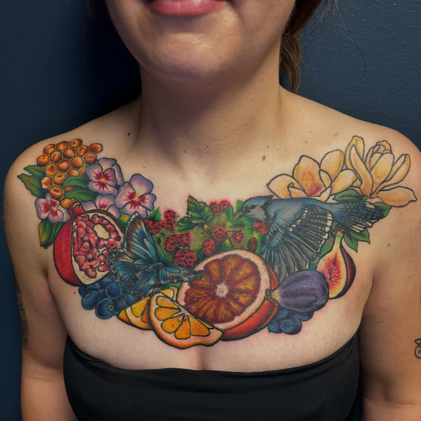 Fruit and floral bouquet realism tattoo on the chest by Maggie De La Torre ๐ณ๏ธโโง๏ธ๐ฒ๐ฝ