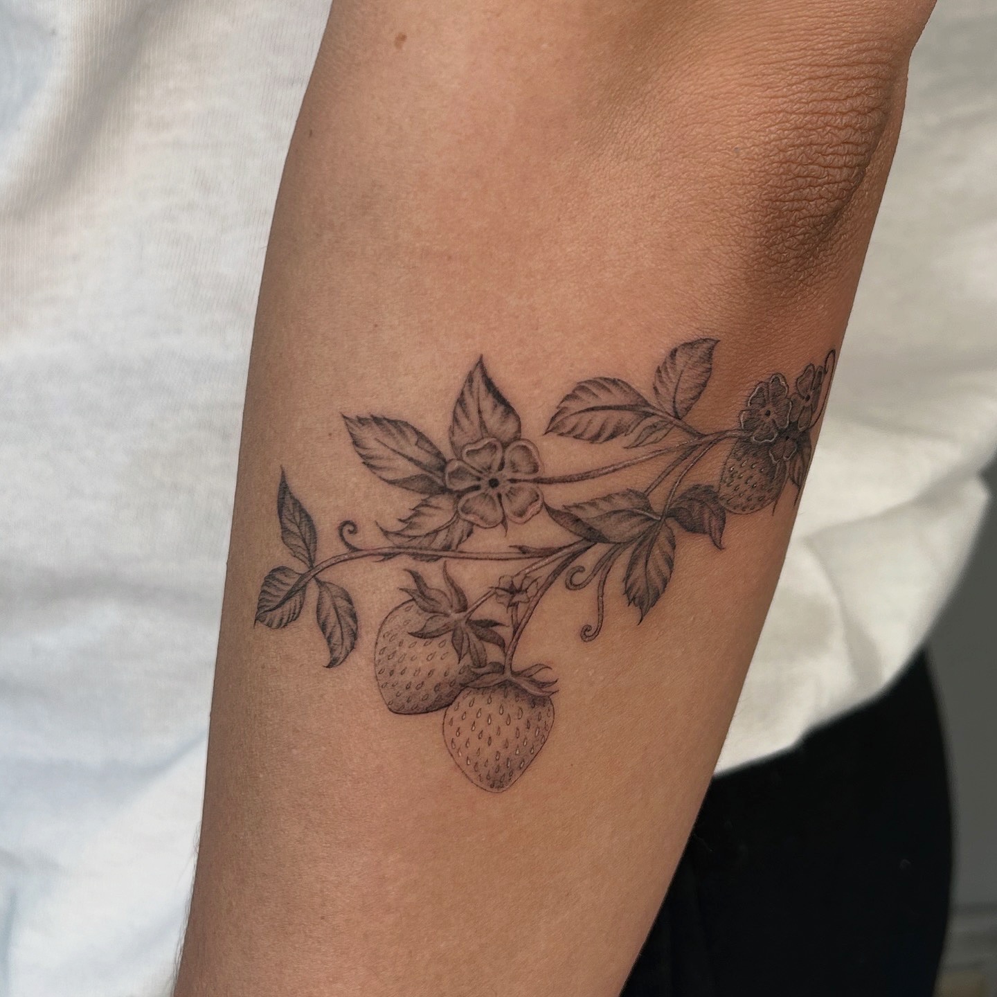 Strawberry plant black and grey tattoo on the forearm by ✭ Elisa ✭