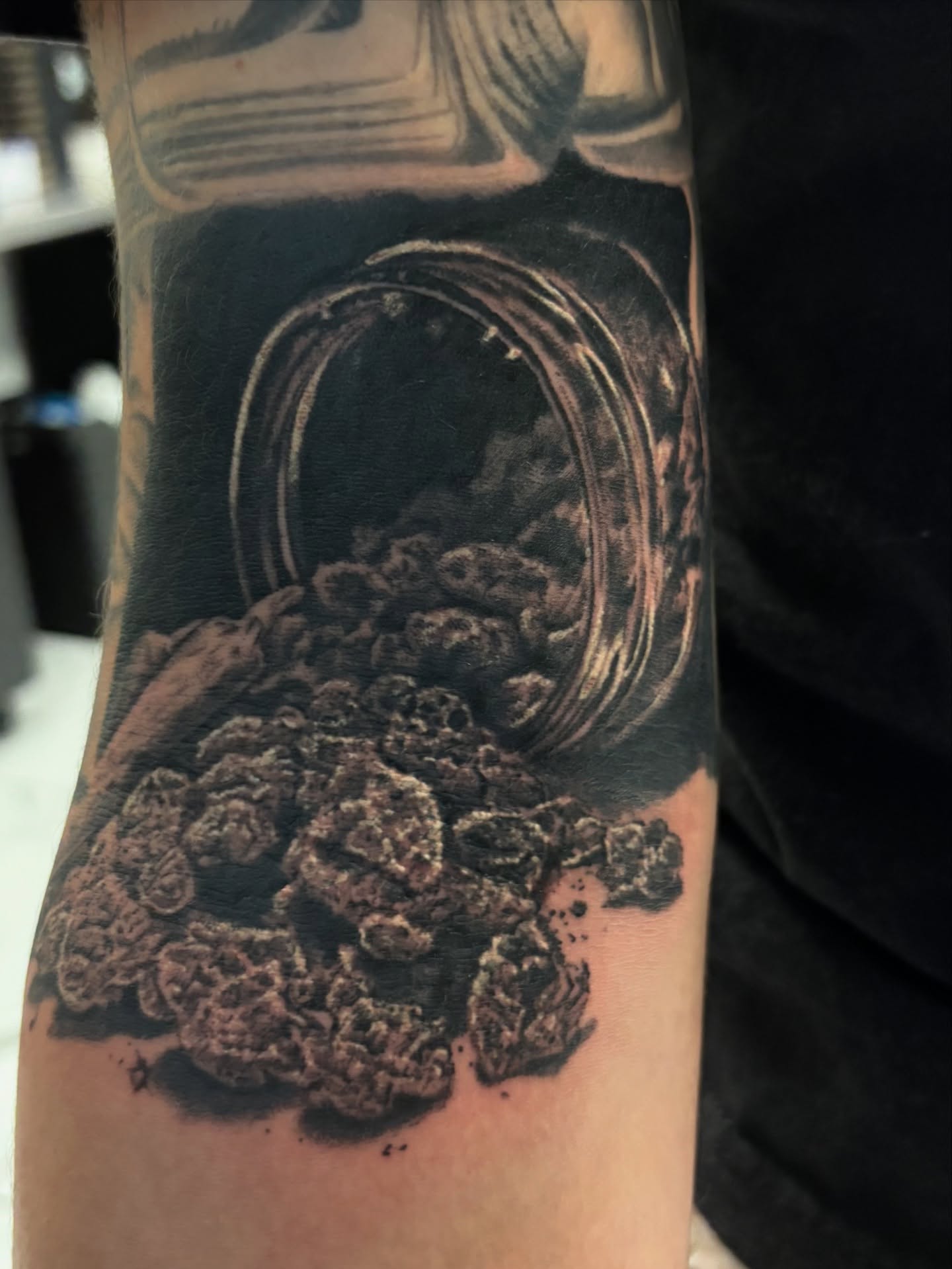 Marijuana buds black and grey tattoo on the forearm by Cristiano Ochoa, Elk Grove, California