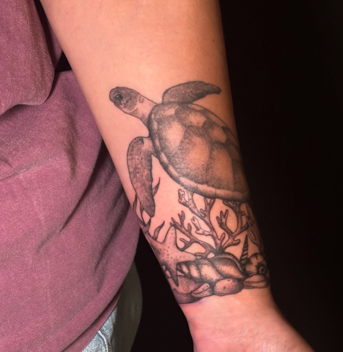 Sea turtle black and grey tattoo on the forearm by Sarah Sacco
