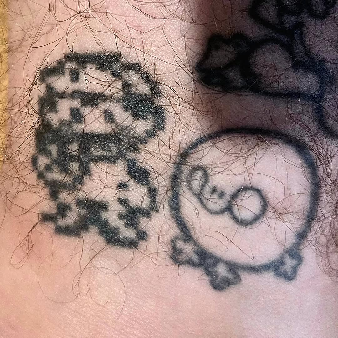 Pixelated skull and abstract circle design new school tattoo by π«