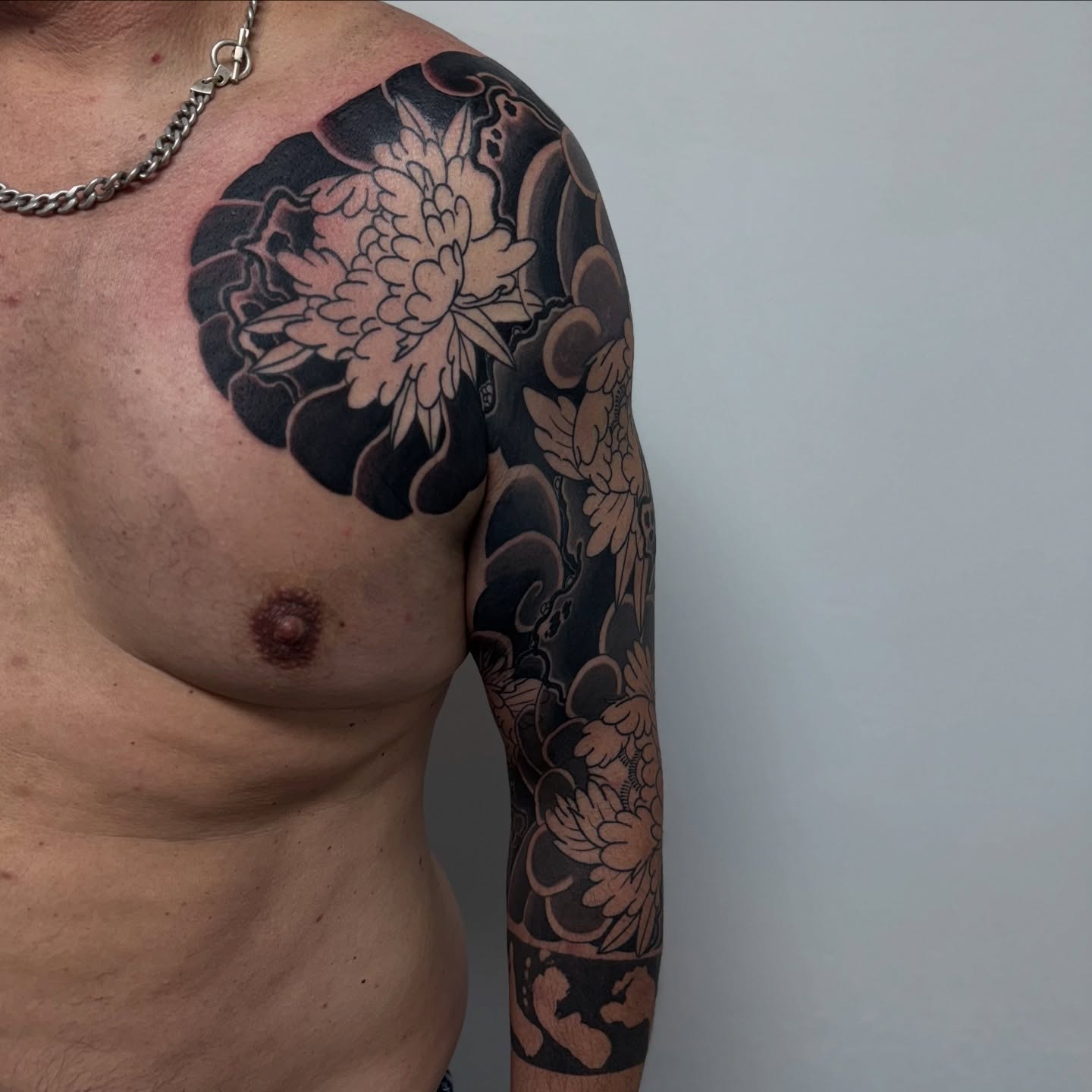 Peony black and grey tattoo on the shoulder by Zack Yang, Houston, Texas