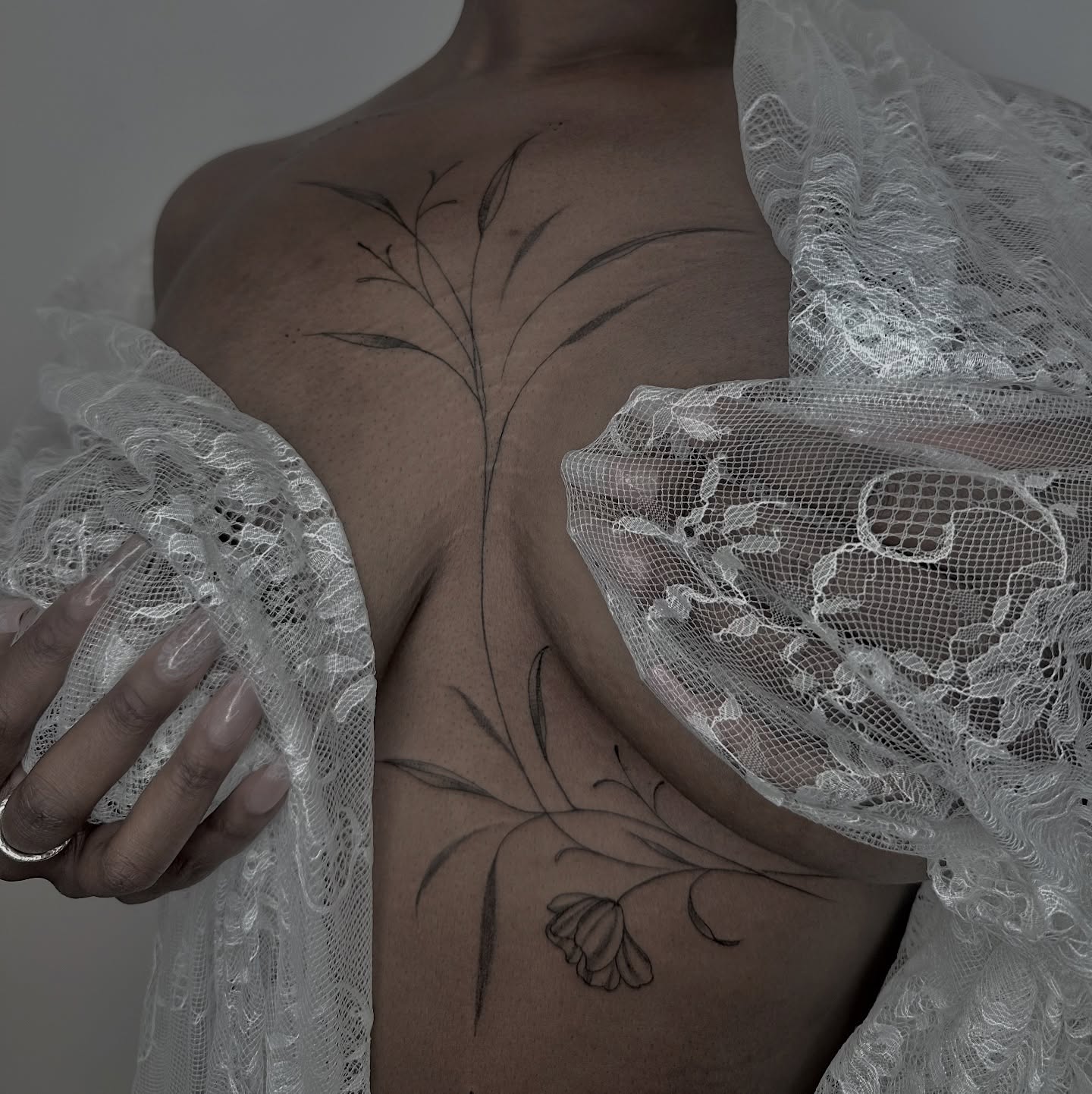 Flower and leaves black and grey tattoo on the chest by 莹Fineline