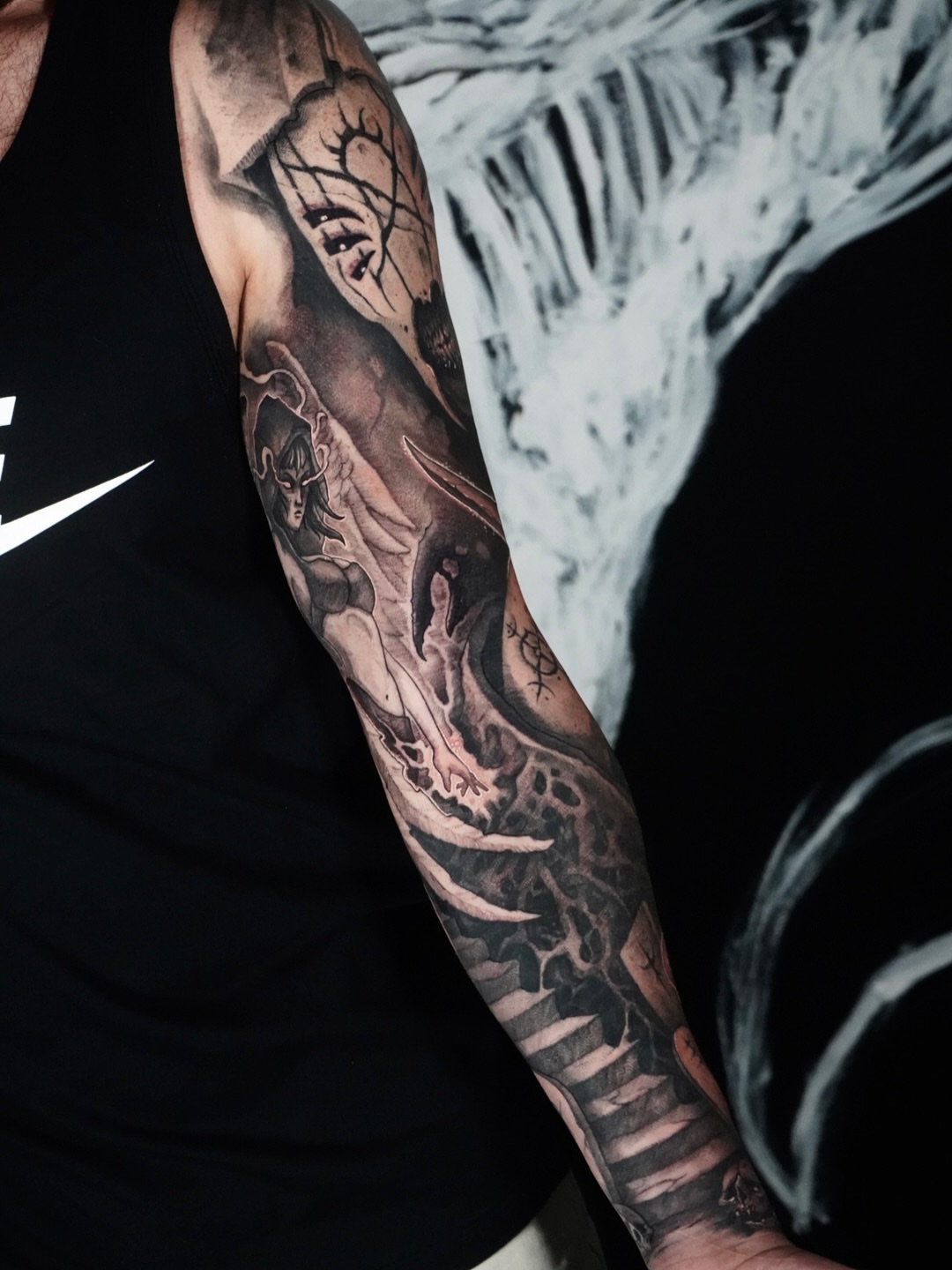 Demon and dragon realism tattoo on the forearm by Jamie