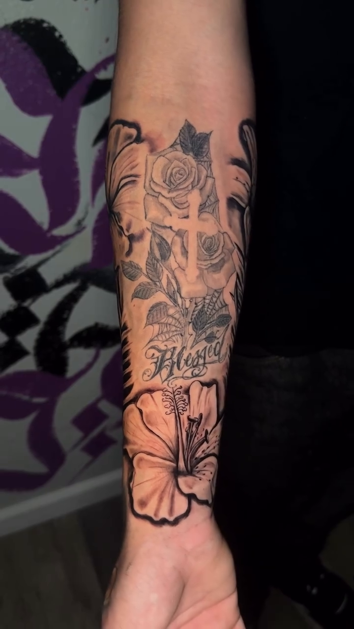 Floral arrangement with cross and script realism tattoo by San Diego Tattoo Artist