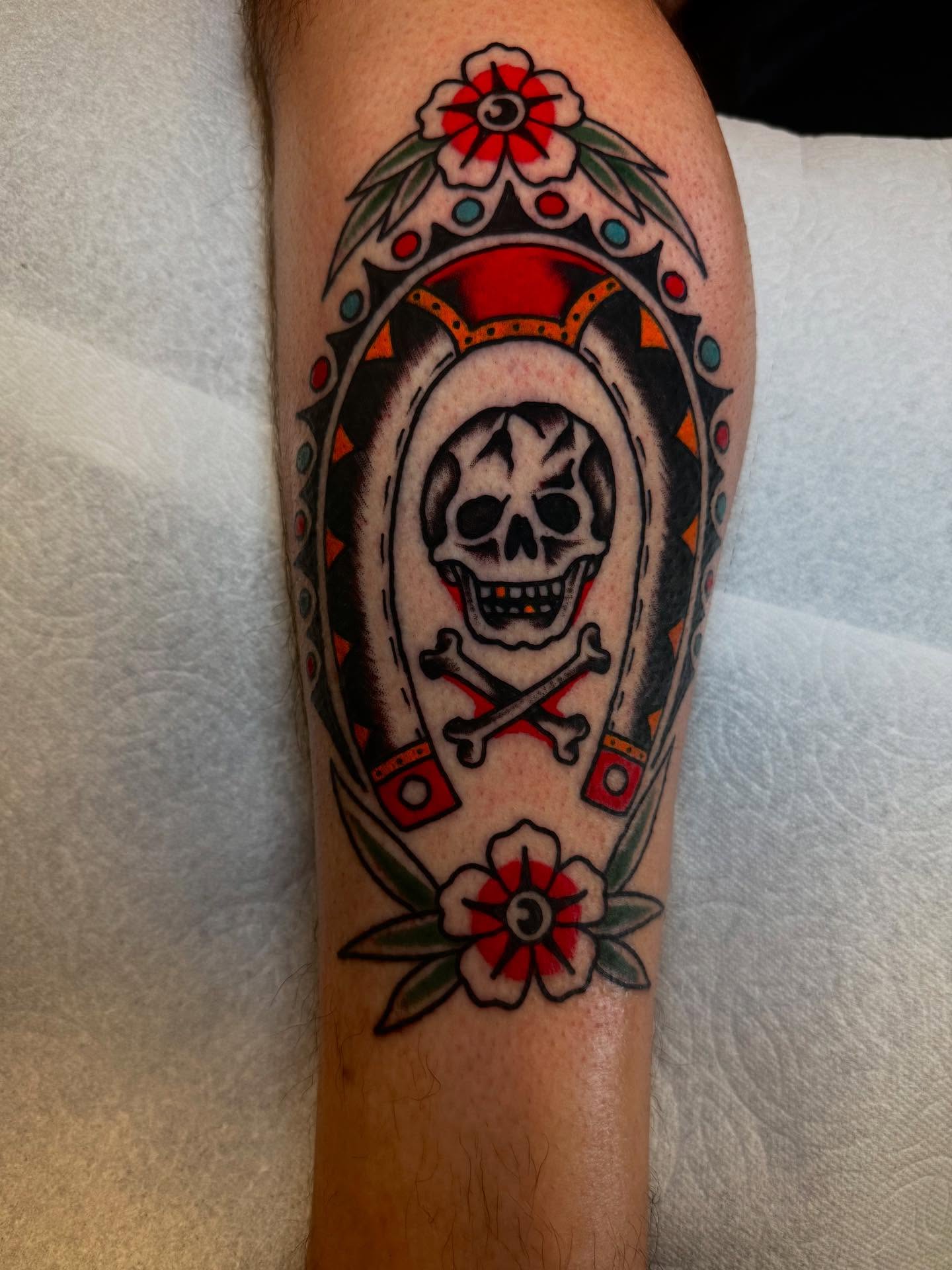 Skull and crossbones American traditional tattoo on the forearm by Noah Diffenderfer, Phoenix, Arizona