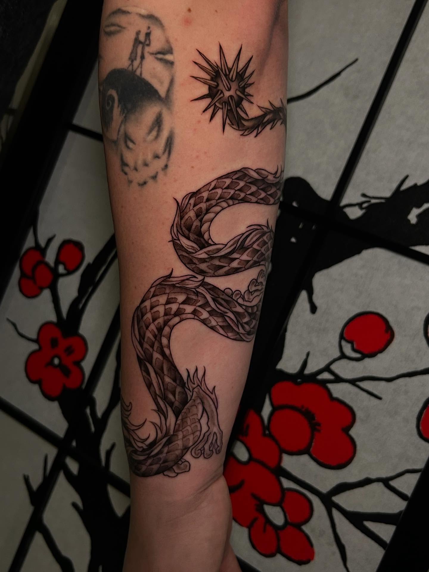 Snake geometric tattoo on the forearm by Chloe