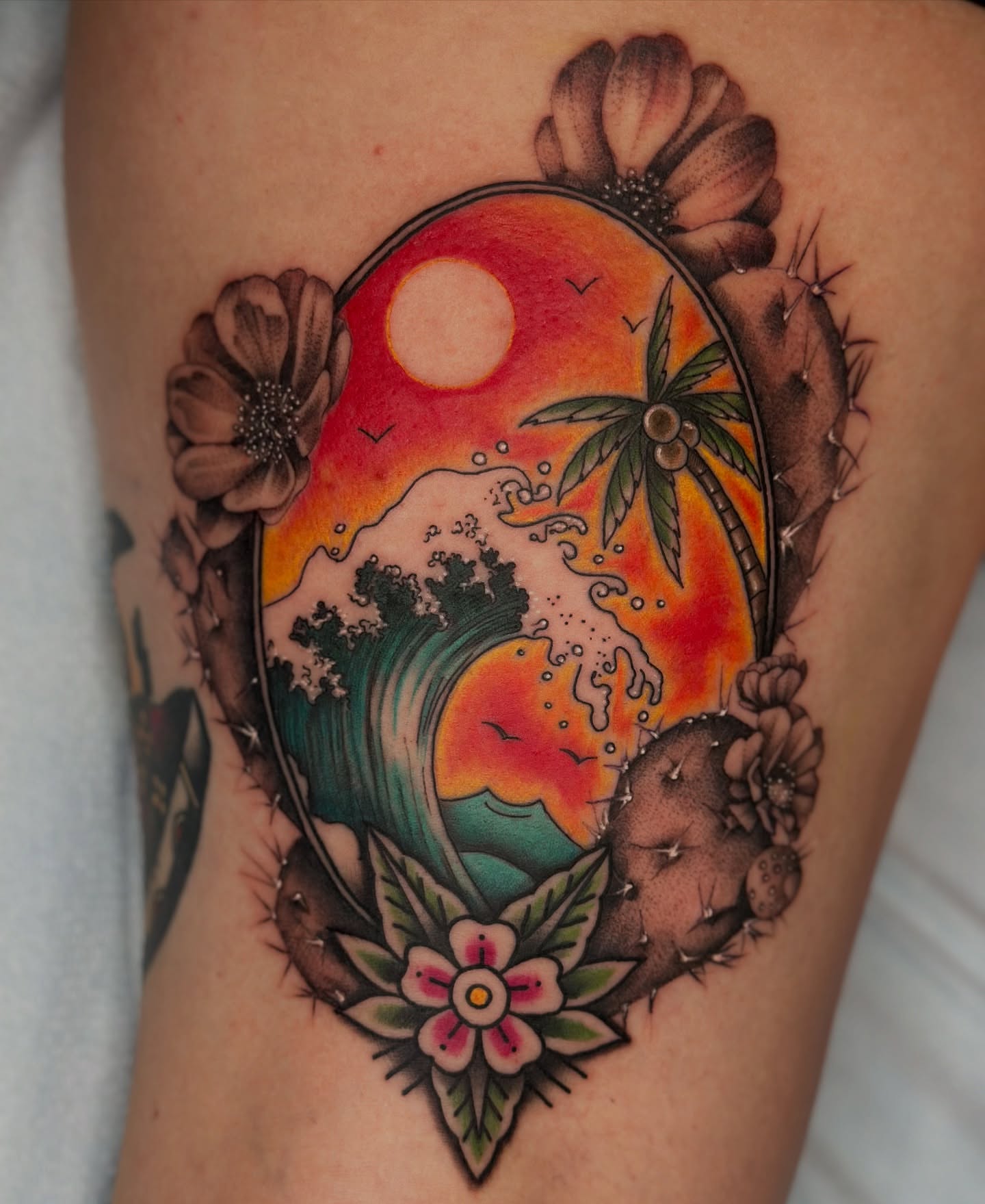 Sunset wave American traditional tattoo on the thigh by Feliz Manzanedo, Prescott, Arizona