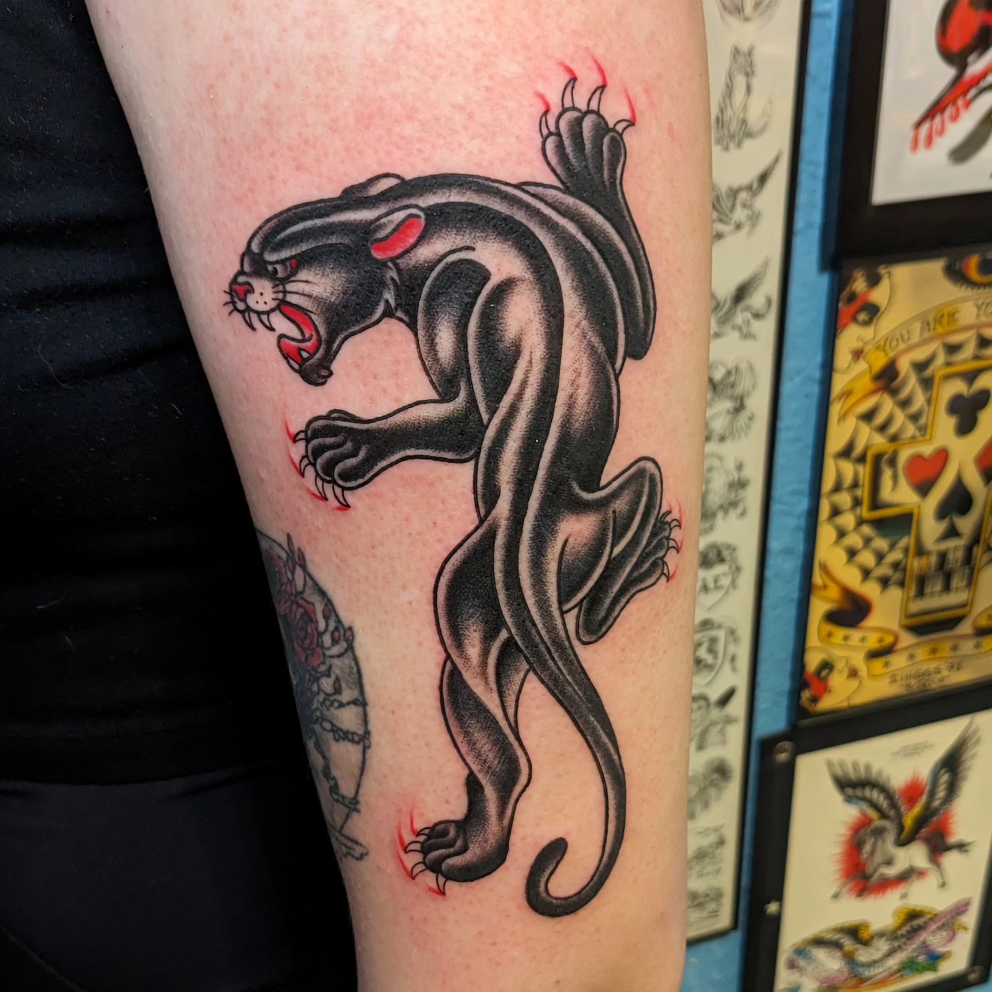 Panther American traditional tattoo on the forearm by Matt Simmonds