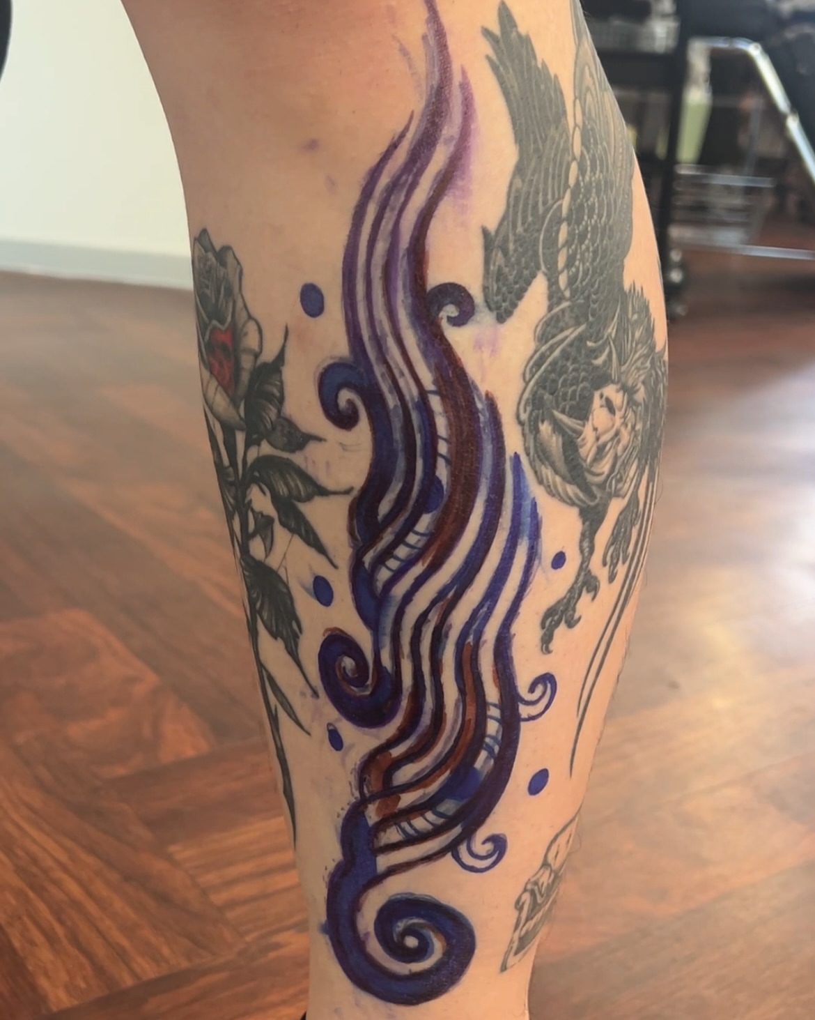 Swirls and roses neo-traditional tattoo on the forearm by Fisher Man