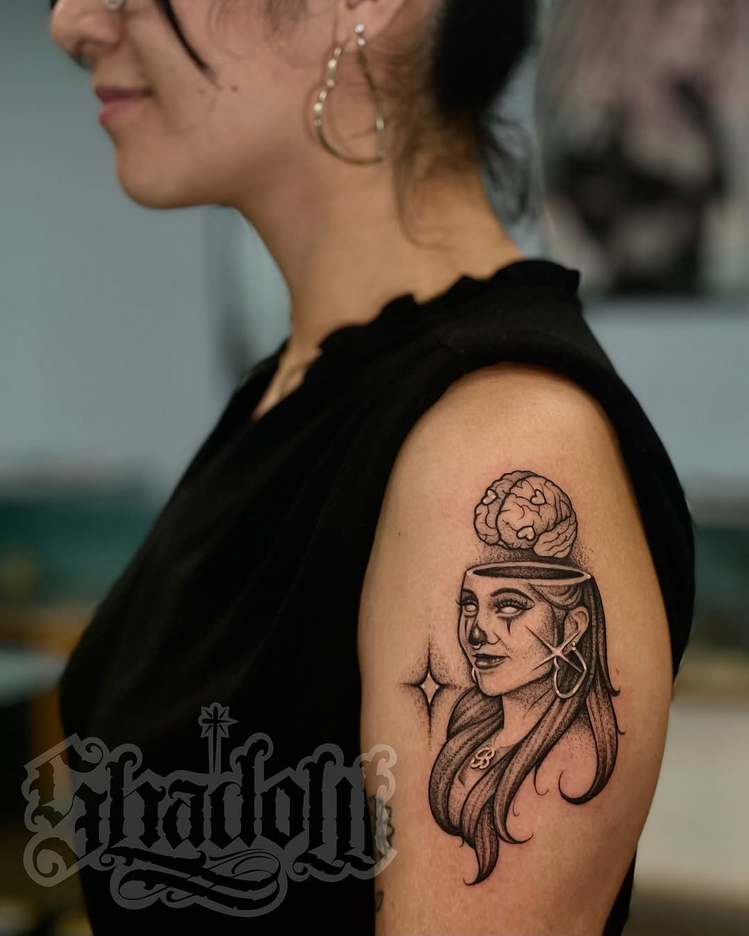 Woman with brain on head Chicano tattoo on the shoulder by Shadoww Espinoza