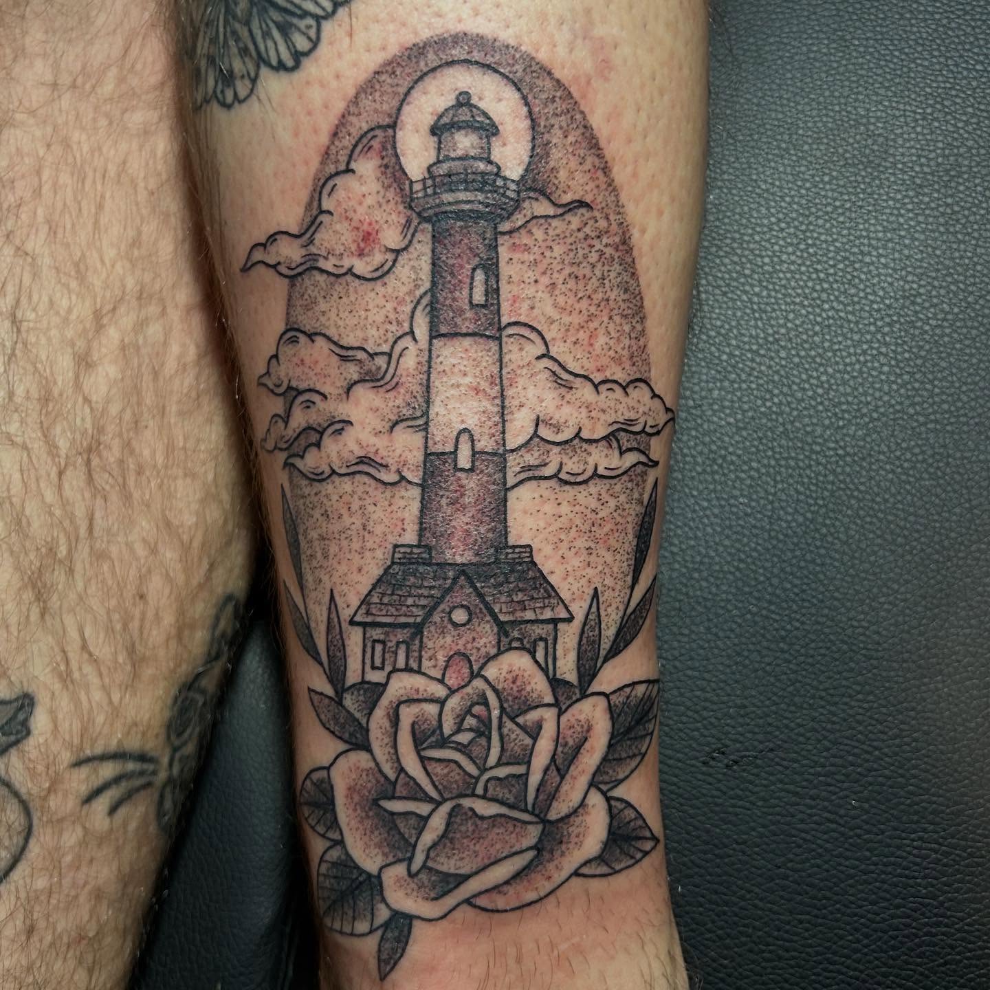 Lighthouse and rose American traditional tattoo on the forearm by Jaime Gaiti