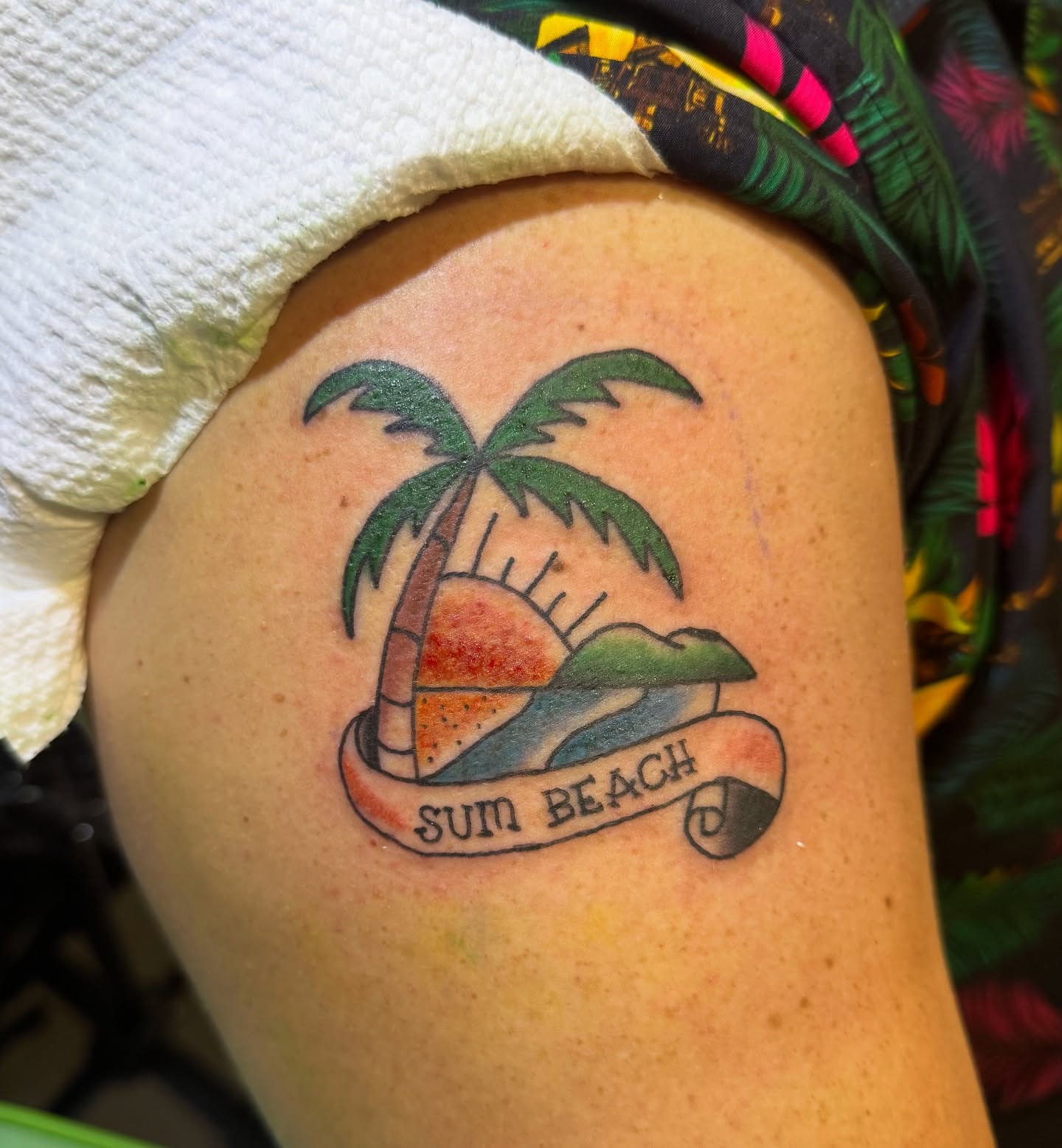 Palm tree sunset new school tattoo on the thigh by Minxxy Tattoos