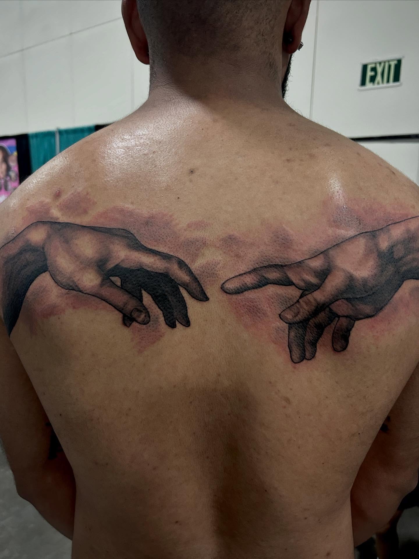Hands realism tattoo on the back by Josh Williams, Chattanooga, Tennessee