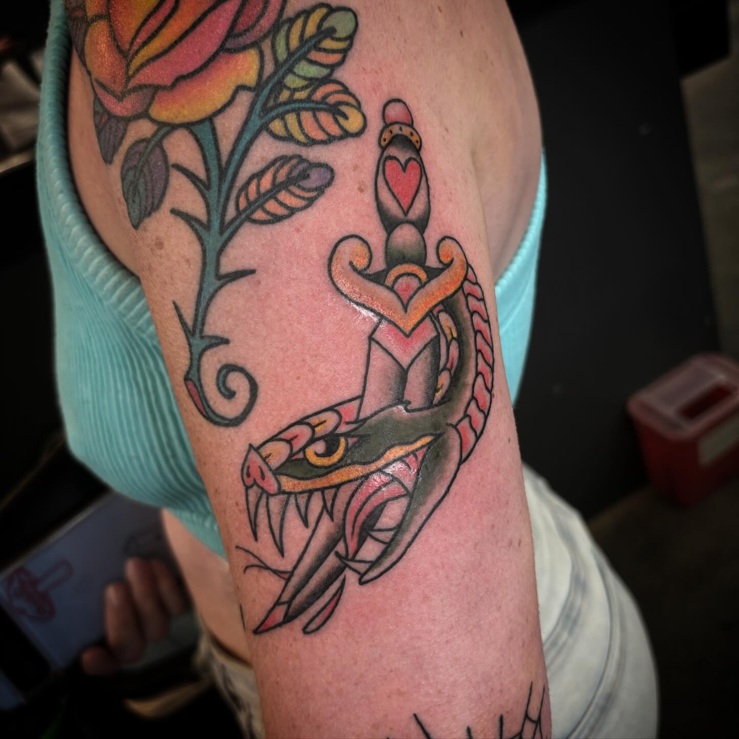 Anchor and roses American traditional tattoo on the forearm by Brett Ferguson