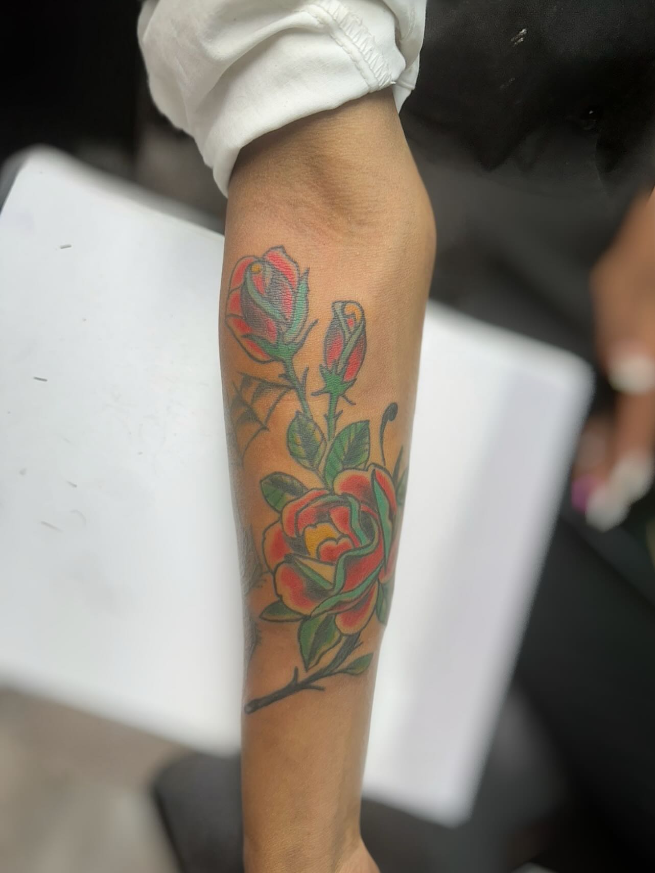 Roses American traditional tattoo on the forearm by @brocks_tatt_attic_, New Orleans, Louisiana