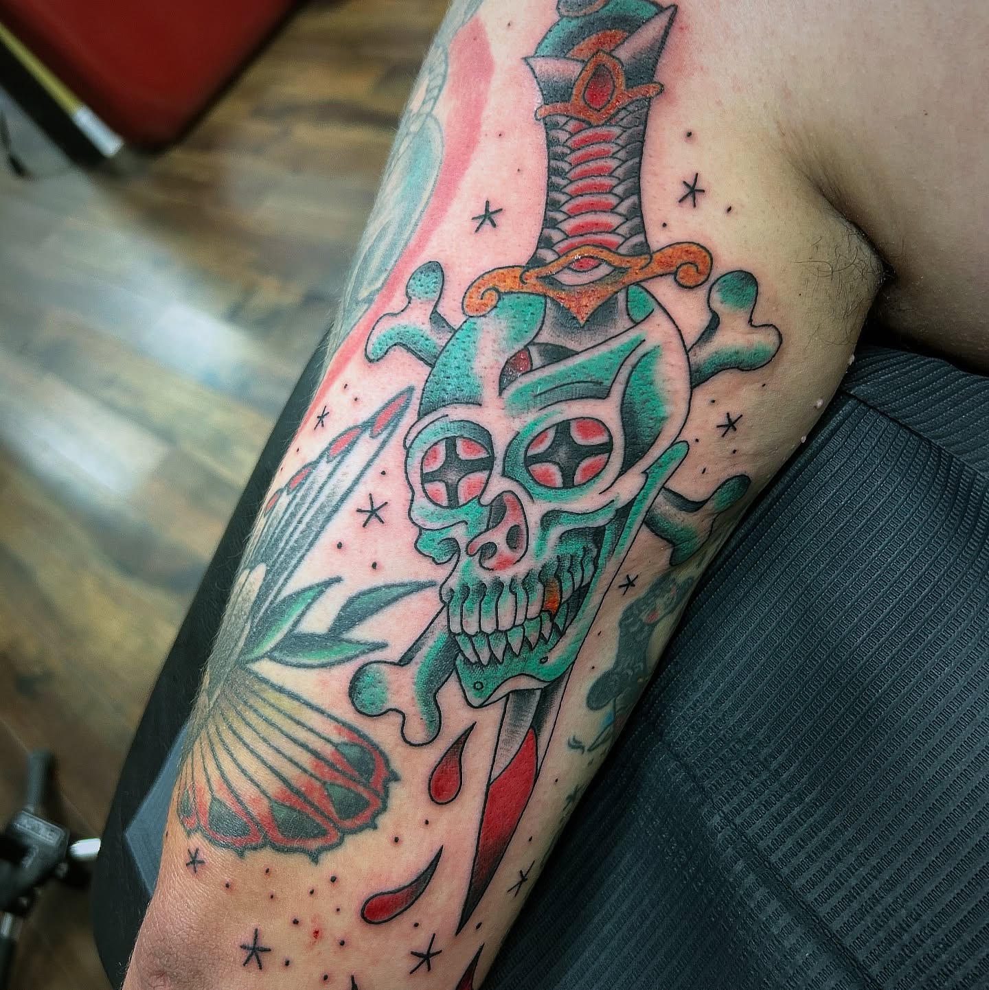 Skull and dagger American traditional tattoo on the forearm by Patricia Cunningham