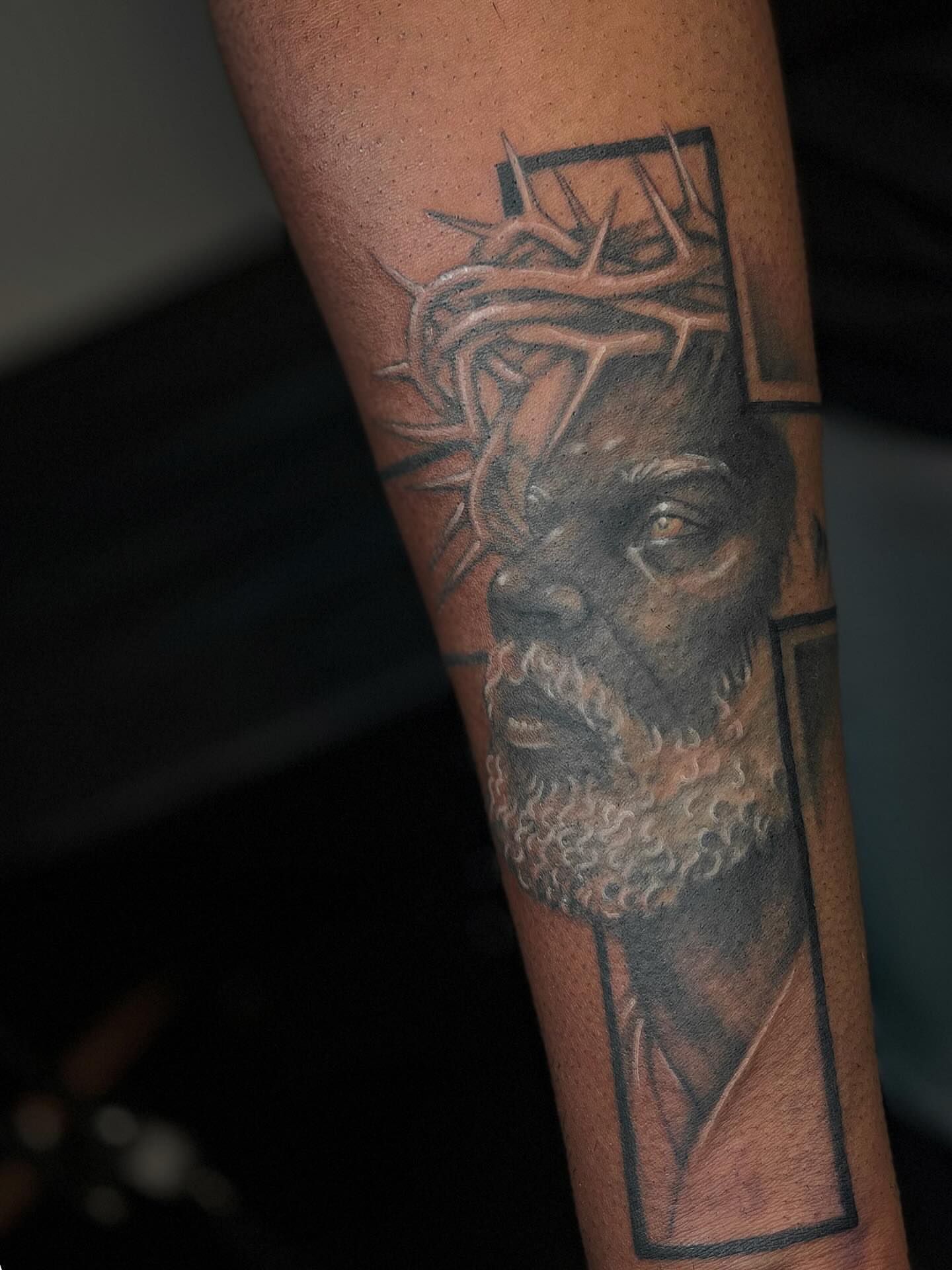 Religious figure realism tattoo on the forearm by Katlyne Jones