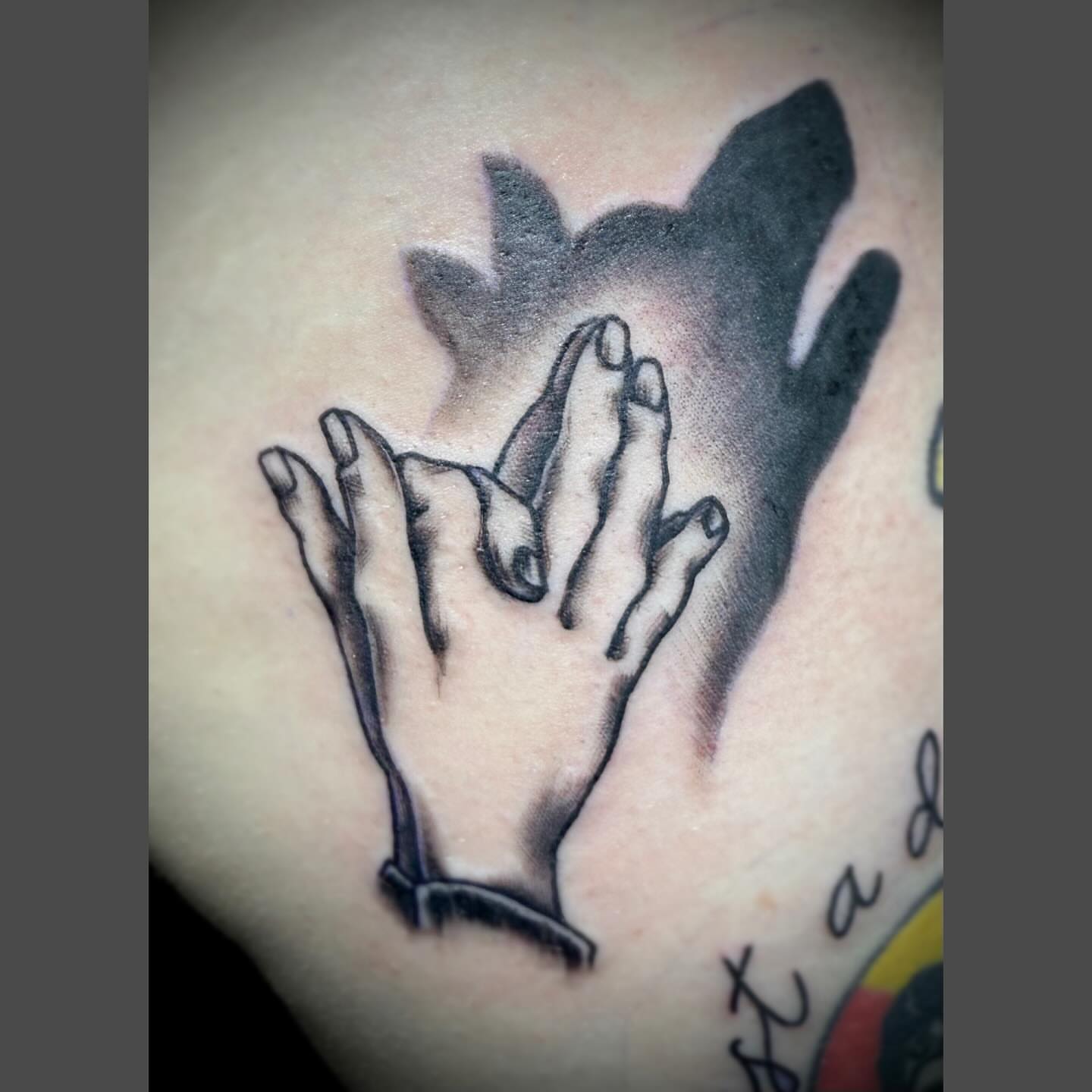 Hands black and grey tattoo on the shoulder by Richard Nagy, New Orleans, Louisiana