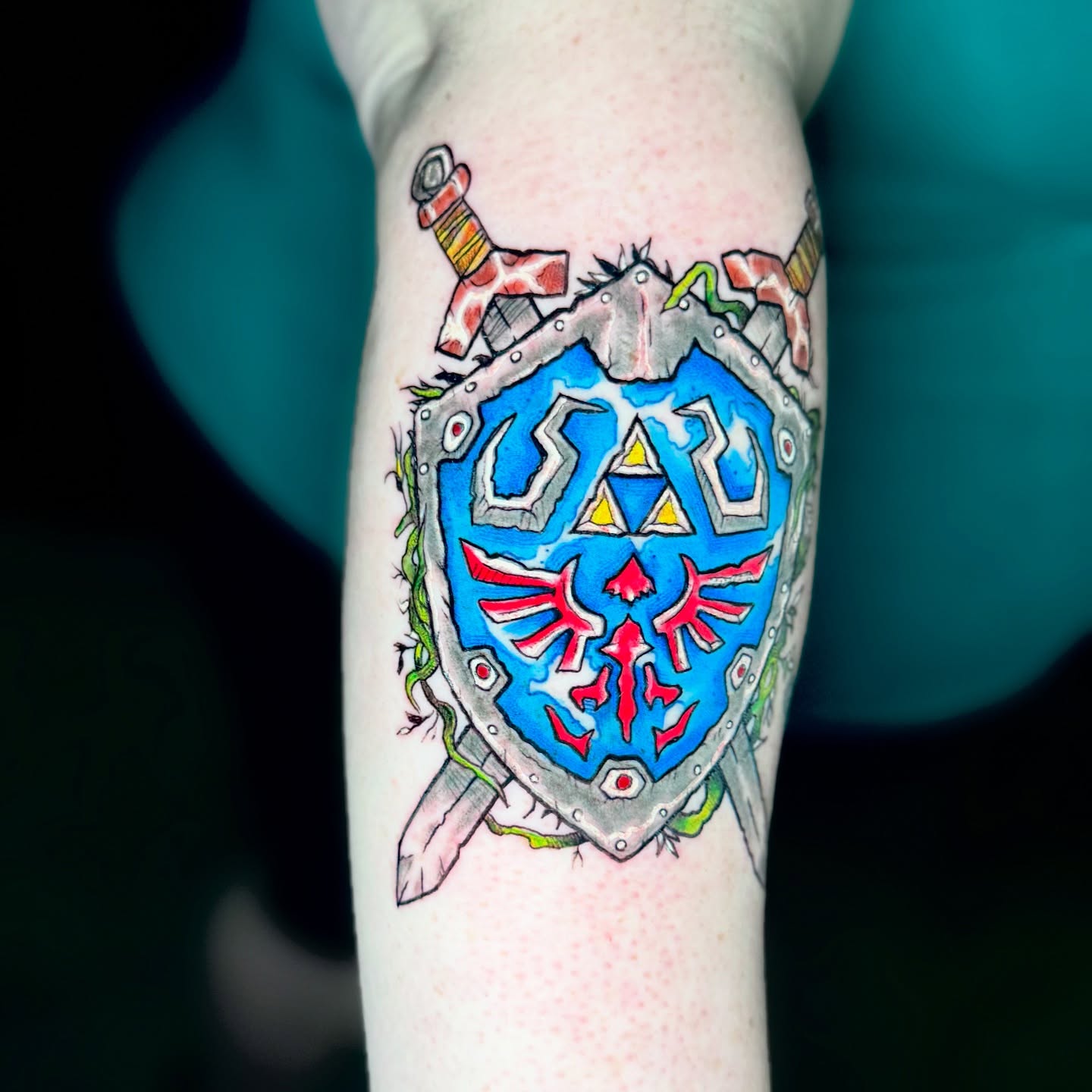 Hylian Shield new school tattoo on the forearm by Kevin A. Salinas ๐จ๐ด, Houston, Texas