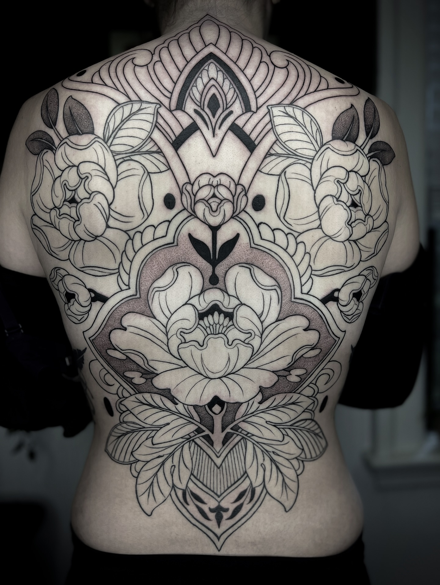 Floral mandala ornamental tattoo on the back by Kaysee Shuster