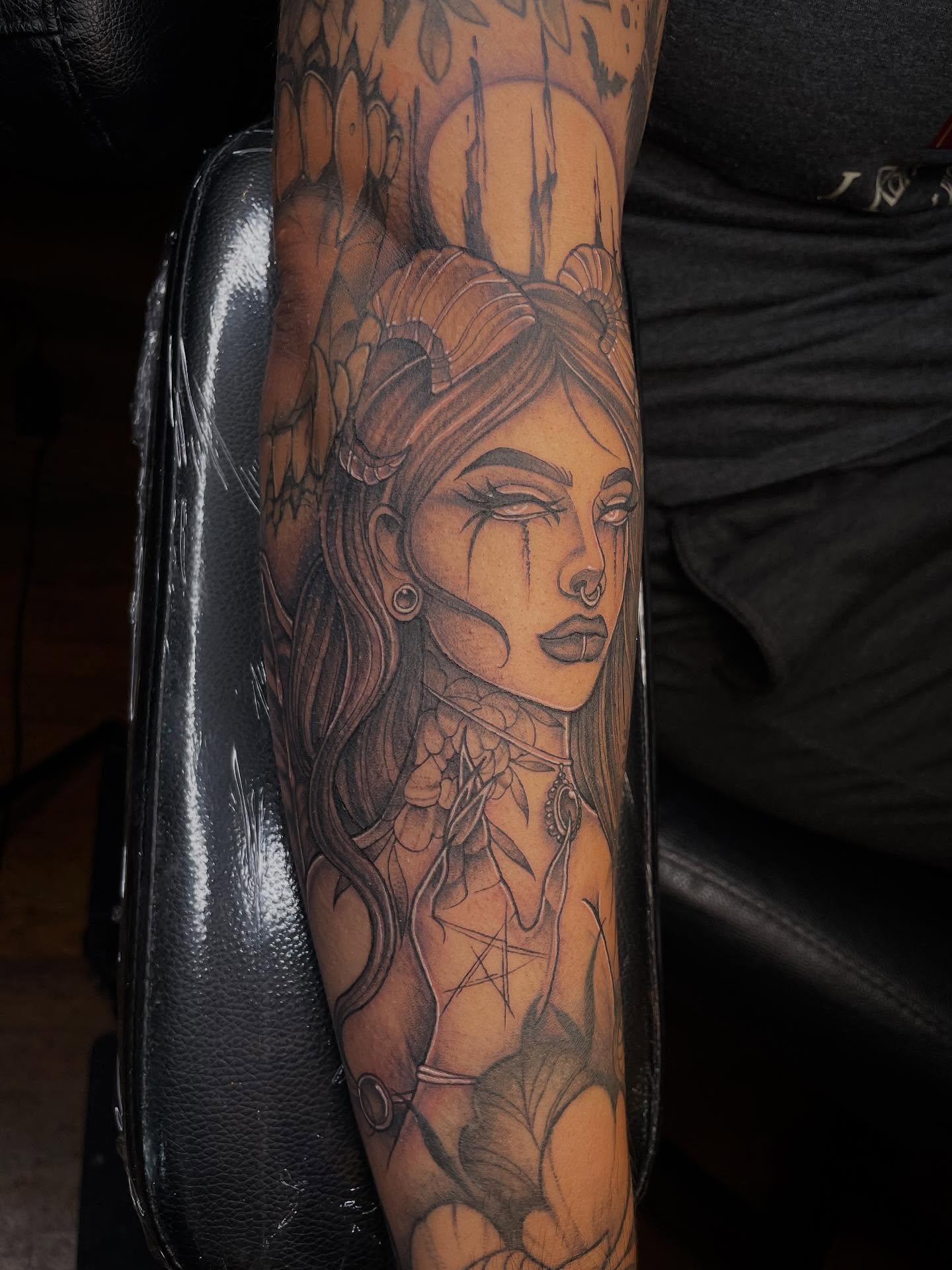 Woman with horns realism tattoo on the forearm by Lauren Sisouphanh, Canton, Ohio