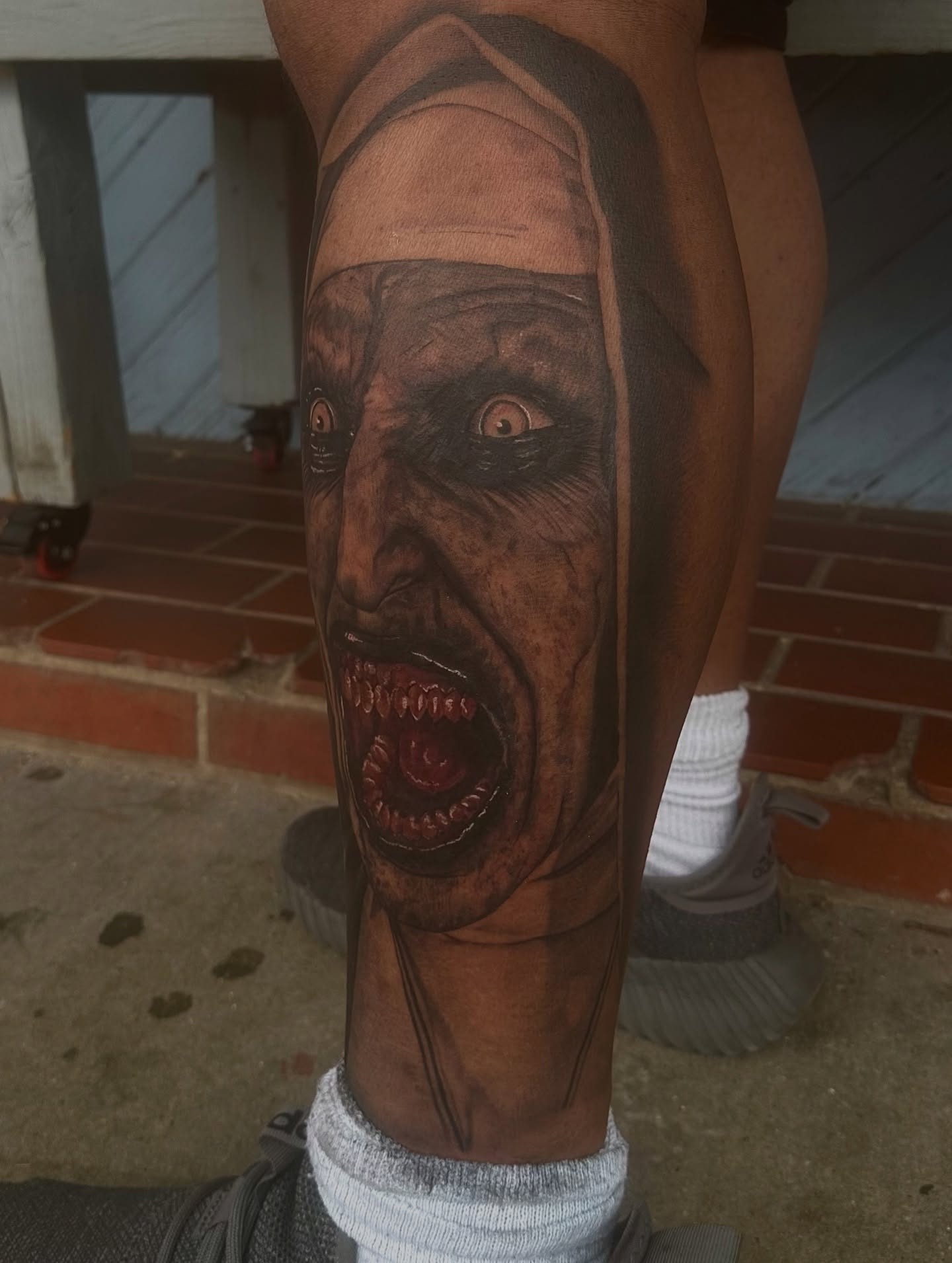 Horror face realism tattoo on the forearm by Carly🪲 greensboro tattoo artist, Greensboro, North Carolina