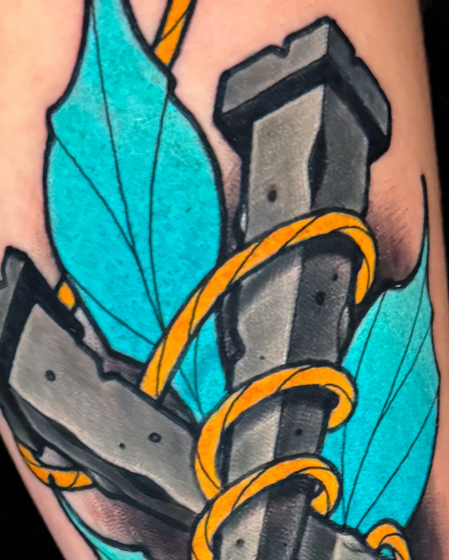 Gun and leaf American traditional tattoo on the forearm by Austin Britt